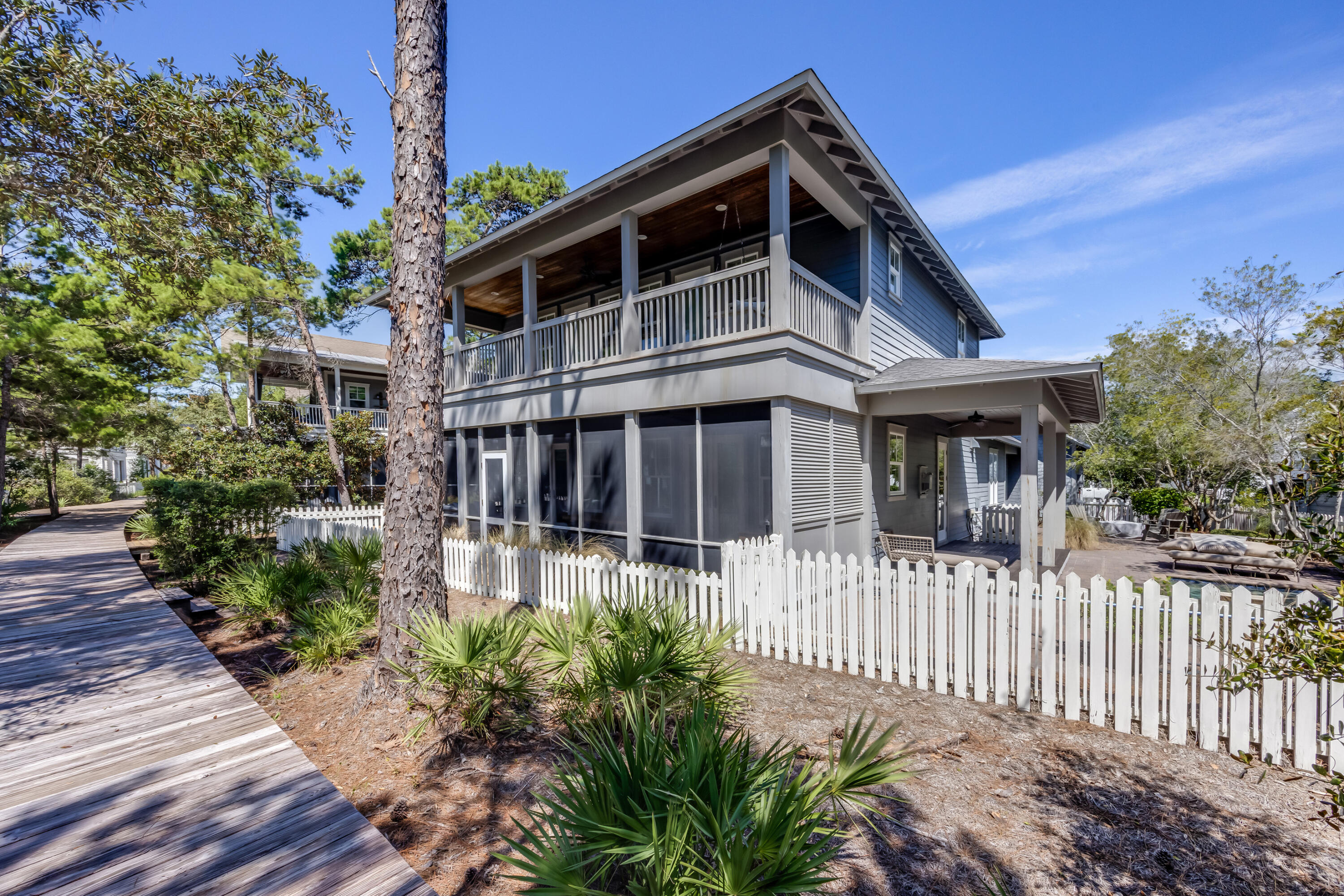 Located in the gated enclave of Watersound West Beach, this fully furnished 4BR/4.5BA, 2,833 sq ft coastal estate blends refined luxury with effortless beachside living. Built in 2014, it offers an open-concept living area with fireplace, a gourmet kitchen with island and pantry, and a main-level primary suite with spa bath and screened porch access. Upstairs, three en-suite bedrooms and a loft provide comfort for family and guests. Outdoor living features a private pool, fire pit, outdoor shower, and summer kitchen, while high-end finishes include hardwood flooring, custom millwork, and designer lighting. Residents enjoy deeded beach access, walking trails, and many amenities in a secure, prestigious community and the best of the South Walton lifestyle.