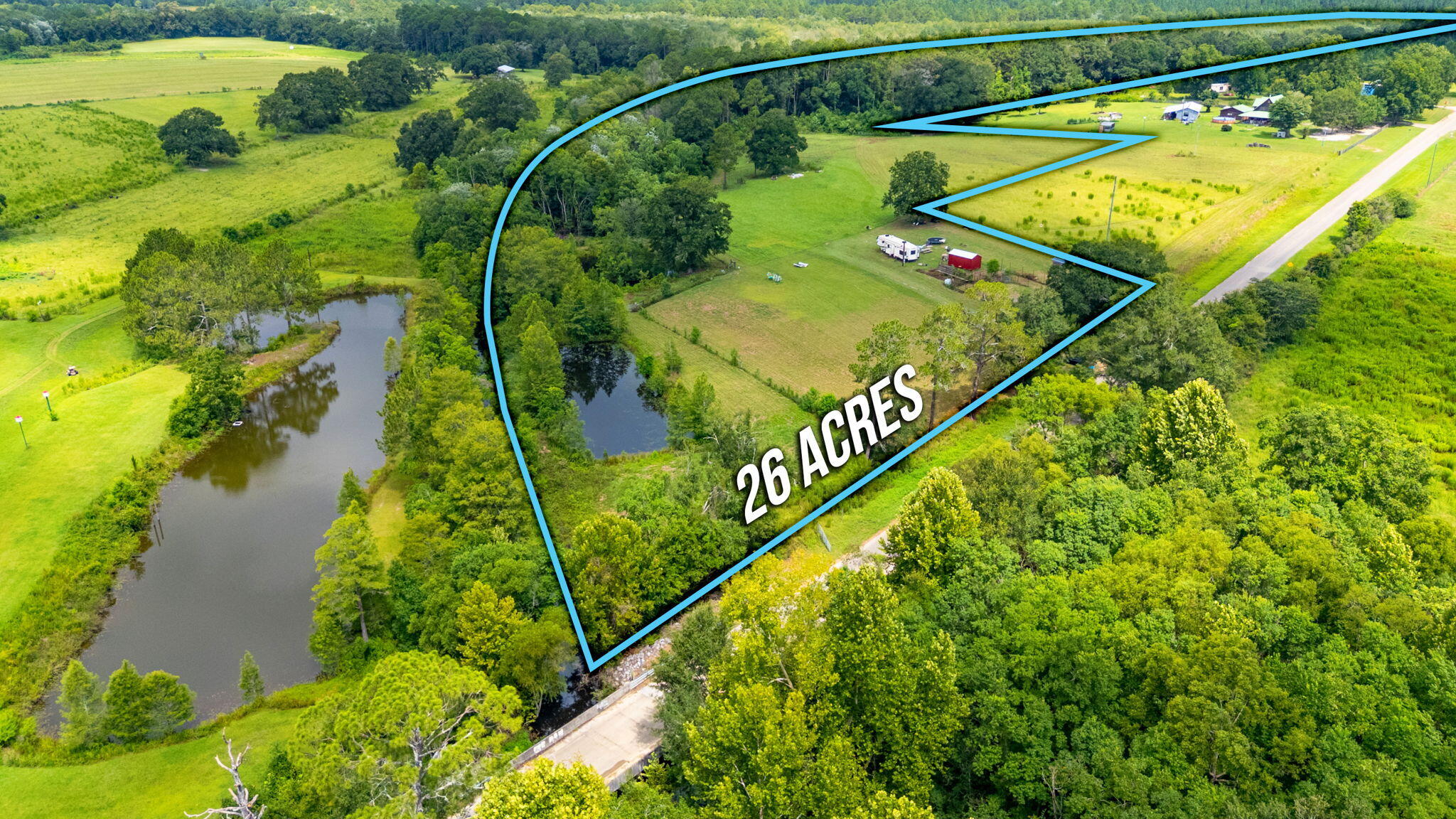 This stunning 26-acre property offers endless possibilities for farming, hunting, or building your dream home. The generous lot features 3 charming ponds, established pastureland, and a mix of longleaf pine and hardwood timber that creates a park-like atmosphere on the north side. Practical amenities include a 10x20 shed, cow pen with shoot, quality fencing with gates, plus power and public water already connected, close to Lake Jackson, and a short drive to the World's Most Beautiful Beaches. Wildlife enthusiasts will appreciate the abundant hunting and fishing opportunities, while the paved road frontage ensures easy access. Whether you're planning to farm, build, or simply enjoy nature's bounty, this well priced gem delivers exceptional value and versatility in beautiful Florala.