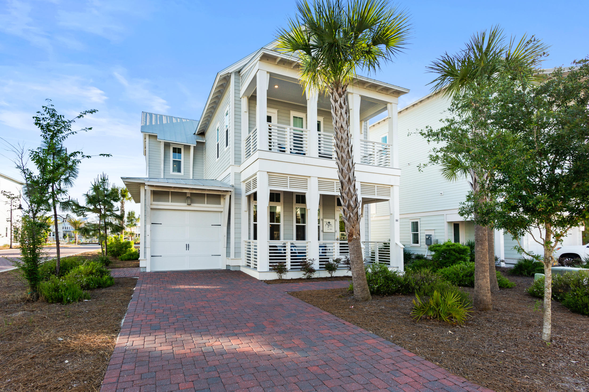 Don't miss this impeccably maintained and beautifully designed, rental machine! This highly sought after luxury 'Laguna' plan can be found in the incredibly popular Prominence South neighborhood on a corner lot, just one lot up from the beautiful community resort pool. The layout is perfect for multi-family use with plenty of room to spread out, while easily able to stroll to the happenings at the Hub! This perfectly designed floor plan offers four bedrooms, four and a half bathrooms and sold fully furnished and rental ready, with over $50k on the books left for this year! Enjoy multiple expansive outdoor spaces throughout the house to truly enjoy beach living. This home has two master suites, up and down, a loft for an additional living room space plus two