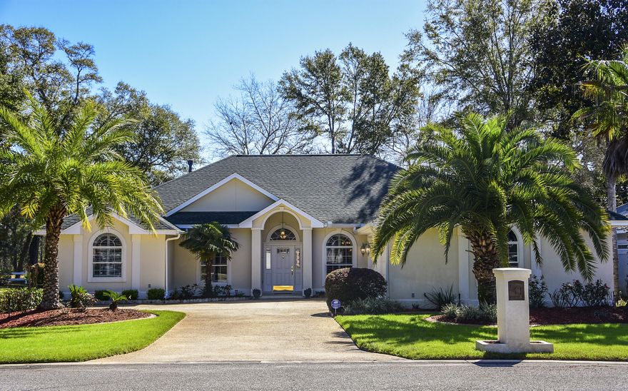 Florida living at its FINEST!! Come view this Bluewater Bay Beauty!! This meticulously maintained and fabulously updated home features 4 bedrooms, 2 full baths, a giant screened-in sun room, an oversized lot + 1/2, 3 car garage, professional upgraded landscaping, floor to ceiling updates, and an amazing location!! New wood-like tile flooring leads you from the front foyer throughout the home and freshly painted walls create a soothing and comfortable feel. The kitchen boasts custom Brazilian blue granite counters, a large center island, double oven, stainless steel appliances, glass tile backsplash, a breakfast bar, and eat-in dining space. NO POPCORN CEILINGS! Plantation shutters, crown molding, new bedroom carpet, oversized padded bay window, double 8 ft glass slider doors to the