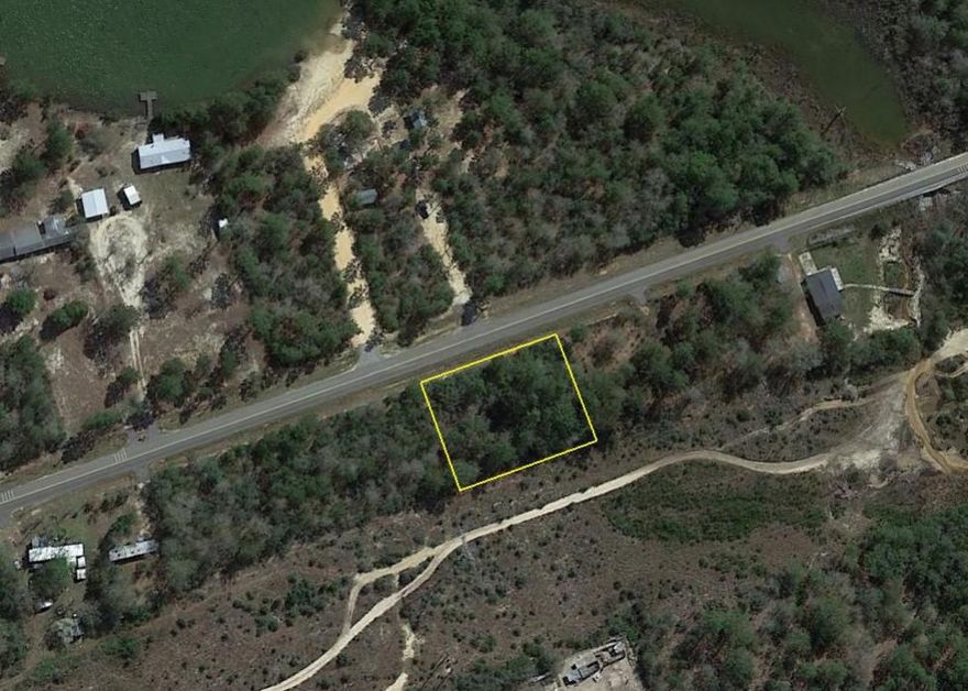 Nice 1/2 acre wooded lot on a paved road. This lot consist of two 1/4 acre lots. Build on both or as one.