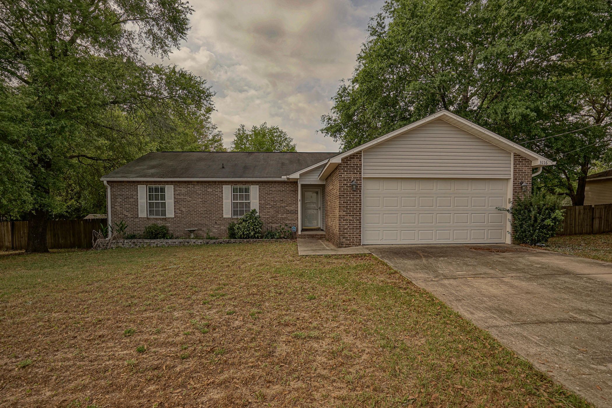 Come see this quaint 3 bedroom 2 bath charming home located in a secluded neighborhood. With a privacy fenced backyard and 2 car garage this home will check the must haves for most buyers looking to purchase. High Quality Laminate and tile floors allows for long lasting durability. The back porch has a retractable awning to allow for outdoor entertainment on rainy days or days when the sun is overwhelming. Features a Master suite with walk in closet and attached Master Bath has dual vanity sinks. Large living room allows for space to spread out and enjoy company along with a spacious kitchen for cooking and prepping meals. Don't miss out on the opportunity to view this amazing home it will GO FAST!!