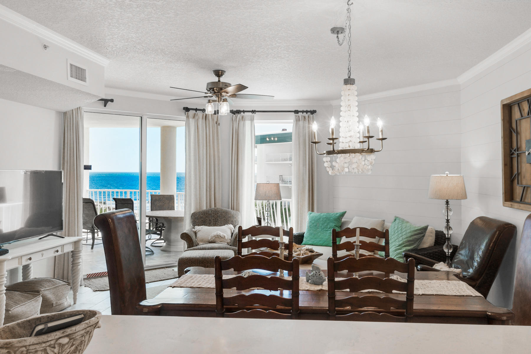Remodeled Gulf-front condo on 30A under $750,000! Flawless coastal design and sweeping views of the Gulf of Mexico characterize this newly remodeled Gulf-front retreat in desirable Seagrove Beach. Prominently located on the third floor at Dunes of Seagrove, unit 302A features two full bedrooms and bathrooms, a separate bunk room and a coveted covered parking space conveniently located directly underneath the building. This masterfully designed condo was just completely remodeled Spring of 2019 and features brand new hardwood tile flooring throughout, brand new quartz countertops in the kitchen and bathrooms, new cabinets, tiled showers, a soaking tub in the master bathroom, custom light fixtures, a shiplap accent wall in the living room and extended kitchen countertops.The master bed-
