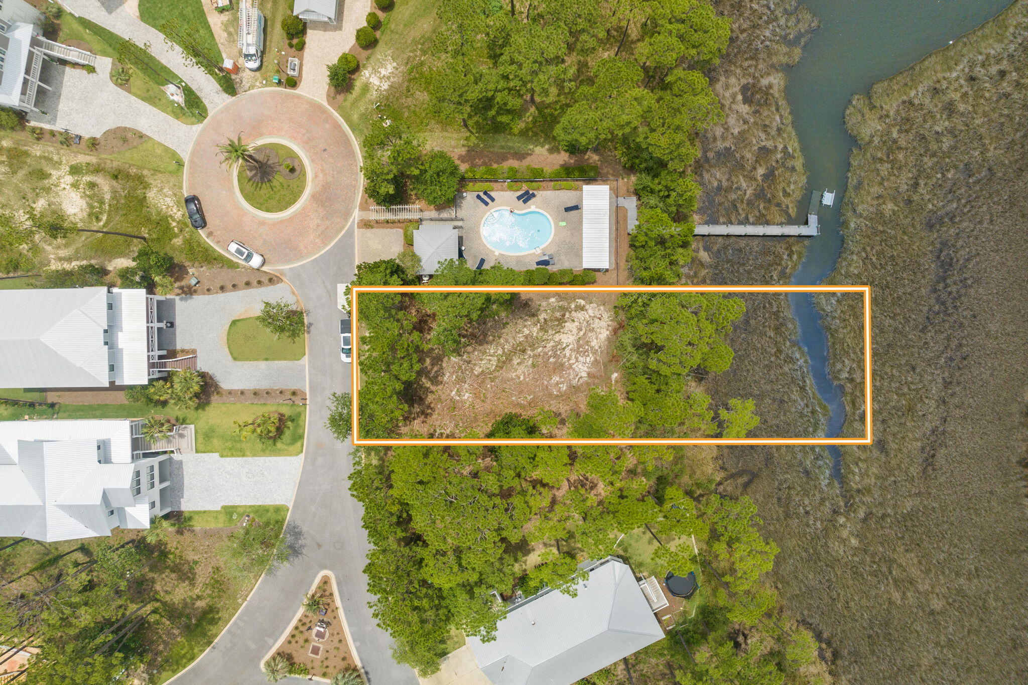 Rare opportunity to own a waterfront lot in an established gated community inside South Walton! Beautiful waterfront lot located adjacent to community pool and dock. Build your dream home on this lot and enjoy the coastal lifestyle with gorgeous water views!Water is not deep enough for a boat but it's perfect for kayaking, Yolo boards and John Boat bayou fishing. A quick drive around the corner takes you to Cesnna Landing boat launch as well.* buyer to verify all dimensions