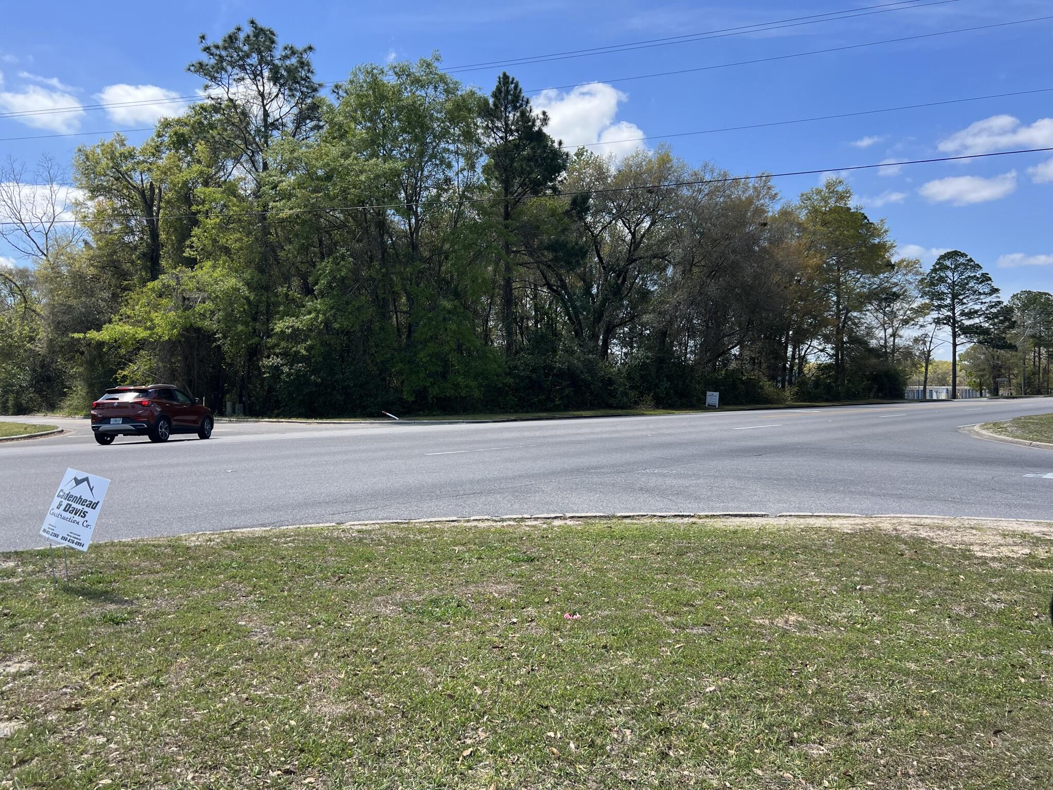 Check out this blank slate of vacant wooded property in the middle of Crestview. This 1.76 acre parcel is zoned mixed use and can be residential, multi family or commercial per Okaloosa Property Appraiser. It is tucked away between businesses and backs up to residential land. This is your opportunity to be creative and develop this plat of land just the way you want.