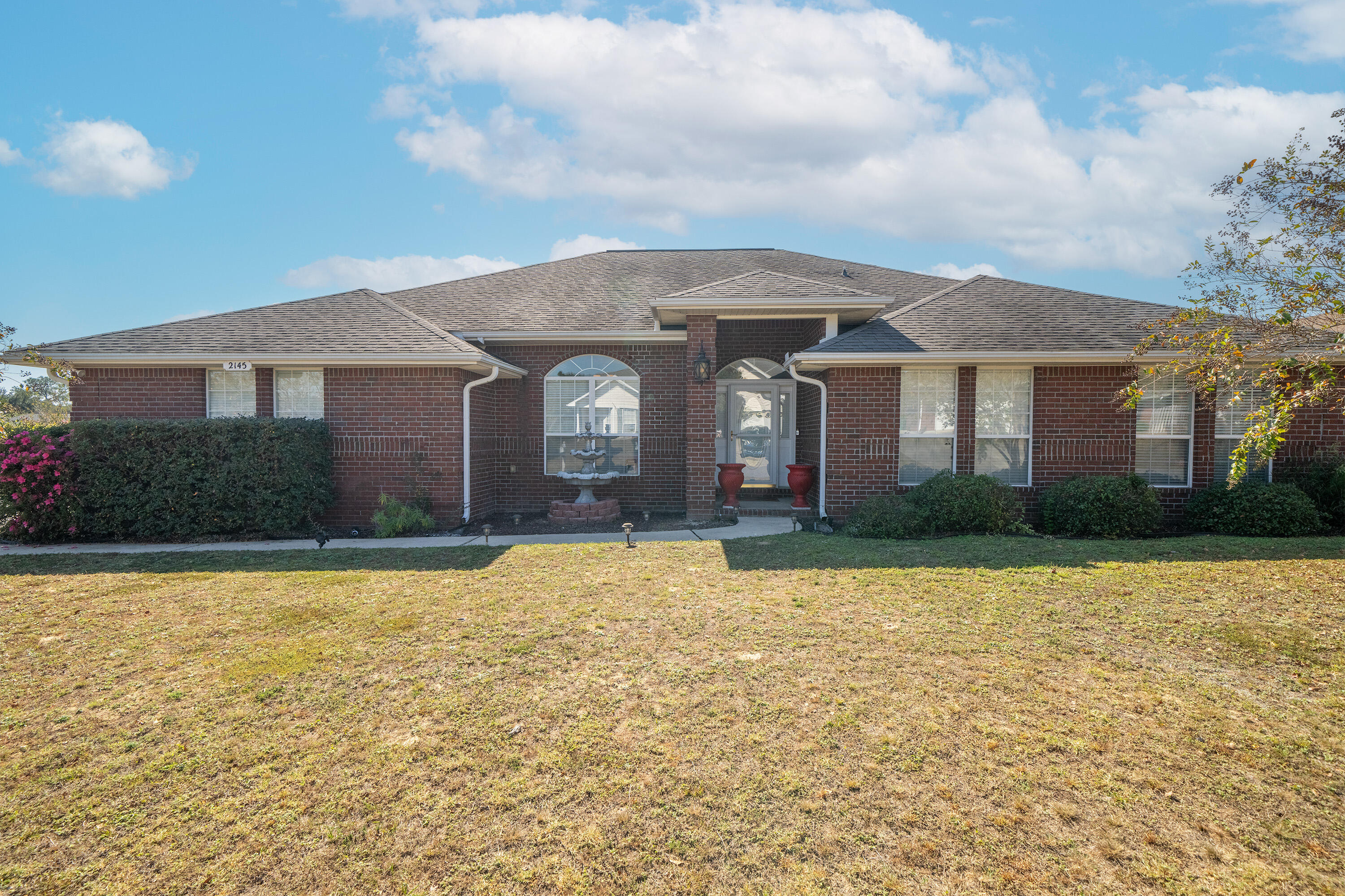 Lee Farms is a desirable neighborhood in Crestview. This beautiful all brick home was built on one of the largest lots in Phase I of Lee Farms, boasting one third of an acre with a privacy fence in the backyard and a large 40 ft. x 14 ft. patio. This 3,000 square foot home is a spacious open floor plan, 4 bedrooms, 3 full bathes and it is one of the largest plans in Lee Farms. Lots of natural light with a large living room, dining room, breakfast area, and kitchen. The chefs kitchen has stainless steel appliance package, ample counter space, cabinet storage, breakfast bar and island. The guests bathrooms are being updated with fresh paint and new tile floors and pictures will be added soon. Located off of the kitchen is the laundry room and an extra room for a small office or lots of storage. Features of the inside of this home include many upgrades such as crown molding in the living room, a spacious primary bedroom with two separate entries, two walk-in closets, whirlpool tub, separate shower, and double vanity. The hallway leads to two full guest bathrooms, and three large bedrooms. Fully fenced yard, irrigation system, ADT security system, and gigantic two car garage are just a few of the amazing features of this home. Lee Farms is highly sought after in the Crestview area for it's safety and security, accessibility to Cleo Park, wonderful neighborhood events such as 4th of July fireworks, trick or treating, and community sponsored events that are so much fun for family and friends.
Also, the corner lot location of this home is the most desirable.
Finally, Lee Farms is convenient to Interstate 10, Antioch Road, and Highway 85 which make it very convenient to go shopping or access other nearby cities. Come see this home today, and enjoy the wonderful opportunities that abound in Lee Farms.
Lee Farms and 2145 Hagood Loop are calling you home, make it yours today! VA Assumable loan too!