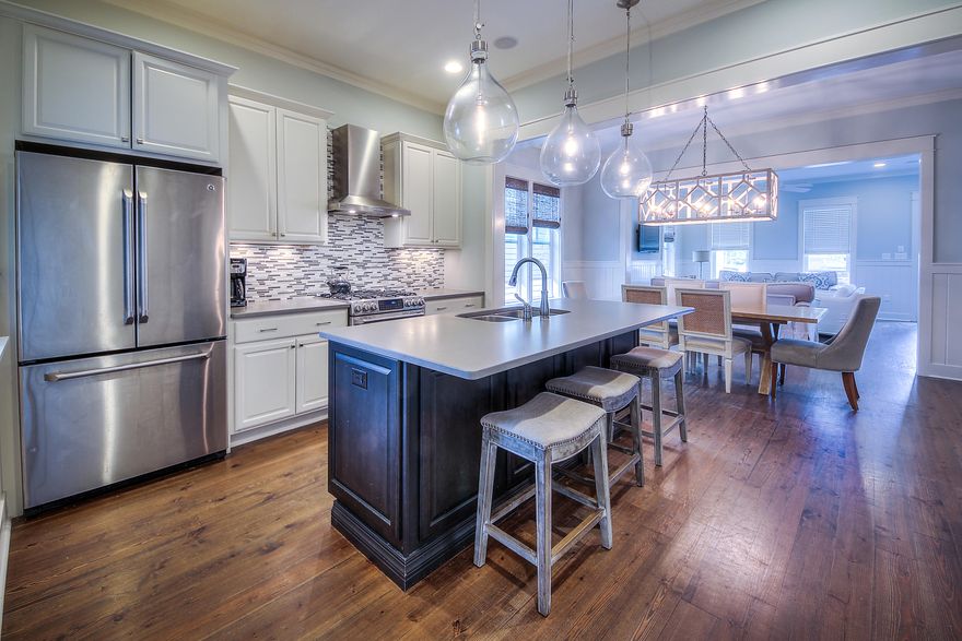 Home is under contract with 72 hour Kick-out Clause. This beautiful 5 bedroom, 4.5 bath home in Watercolor Resort is a must see. This home features hardwood floors throughout, V-Groove wood walls, 10ft ceilings on the first floor, abundant windows, lovely kitchen with Caesarstone countertops, gas range, bar area with wine fridge & gorgeous light fixtures throughout. The home has 2 generous Master suites, one on the first floor and one on the second with private porch, a second floor media area with vaulted ceilings, and 2 additional large bedrooms and the 5th bedroom is a bunk room with full size bunk on the bottom. This home has plenty of storage, with large pantry, closets & a golf cart garage. The home is offered unfurnished, however, the furniture can be purchased separately.