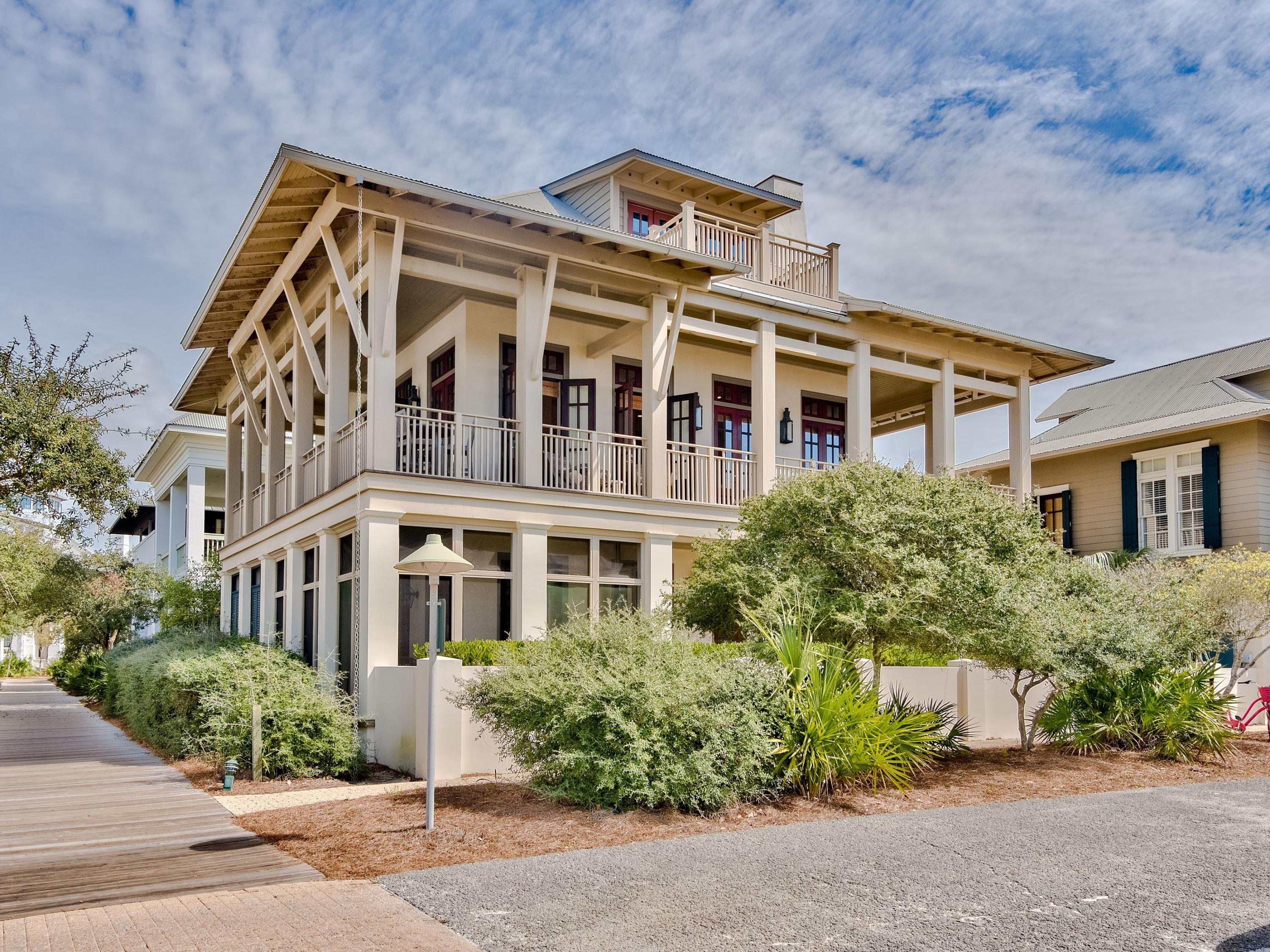 A preferred location with direct boardwalk access to the beach, this treasured Rosemary Beach house offers exceptional Gulf views. Tom Christ, of Christ and Associates, designed a main and carriage house with expansive balconies and porches enjoyed from copious French doors. The three level main house hosts the master suite on Level one with two guest bedrooms and ensuite baths. The second level presents the open living, dining and kitchen plus an adjacent media or game room and full bath. Arranged on the third level is a guest bedroom with ensuite bath. The carriage house provides an autonomous accommodation for guests with their own living and dining, kitchen, bath and lofted bedroom. The Rosemary Beach Town Center is only a block away with the plethora of shops and restaurants for great