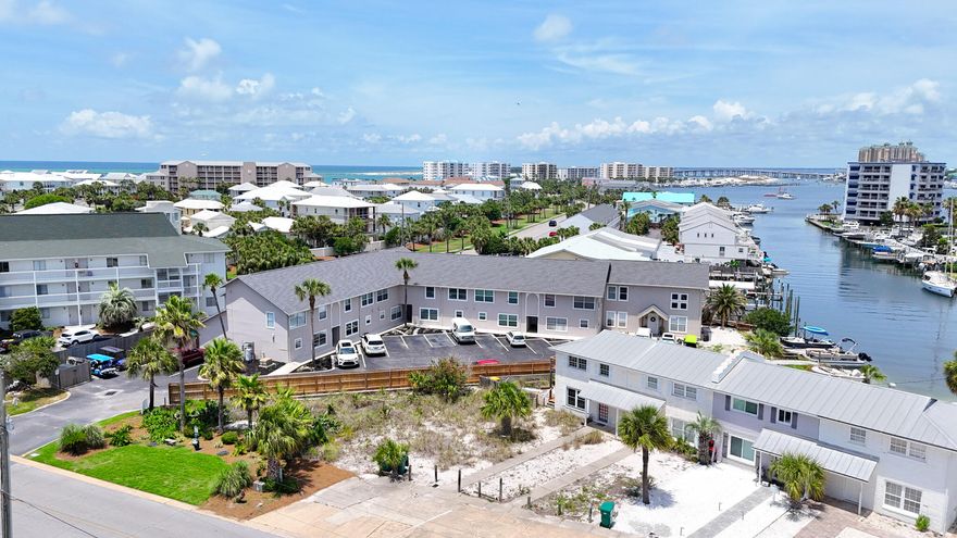 Offered at 146K Under Recent Feb. 2025 Appraisal for a prompt sale! Fully Renovated true 3BR Townhome in Destin - Beach, Boats & Backyard Bliss! Welcome to your slice of paradise on Holiday Isle! Step inside to discover a thoughtfully reimagined interior completely renovated from top to bottom--because who really wants a ''project'' when the beach is calling? Featuring modern finishes, stylish fixtures, and an open layout that invites effortless everyday living and entertaining. Every detail has been addressed- from the flooring and paint to the kitchen and baths - Simply move in and start enjoying the beach life you've been dreaming of. Outside unwind in your private, fenced-in backyard, ideal for grilling, chilling, or reading in a hammock. This outdoor area extends your living space and offers a true sense of retreat.  Location is everything and this home delivers! Enjoy 2 private deeded beach access just a short stroll away & take full advantage of the on-site private dock and shared boat slips perfect for sunset cruises or spontaneous fishing trips, easy access to the Pass, the Gulf, & Crab Island. No boat? No problem. Just call the water taxi to your dock and cruise straight to the best bars, restaurants, & waterfront attractions on the Destin Harbor.  Turnkey, low-maintenance, and loaded with lifestyle perks, this property captures the essence of easy coastal living. Don't miss your chance to own a Beautifully updated townhome in one of Destin's most desirable waterfront communities! Whether you're looking for a trendy beach getaway, a rental investment, or your forever coastal home, this townhome brings the best of Destin right to your doorstep. Schedule your private showing today! 