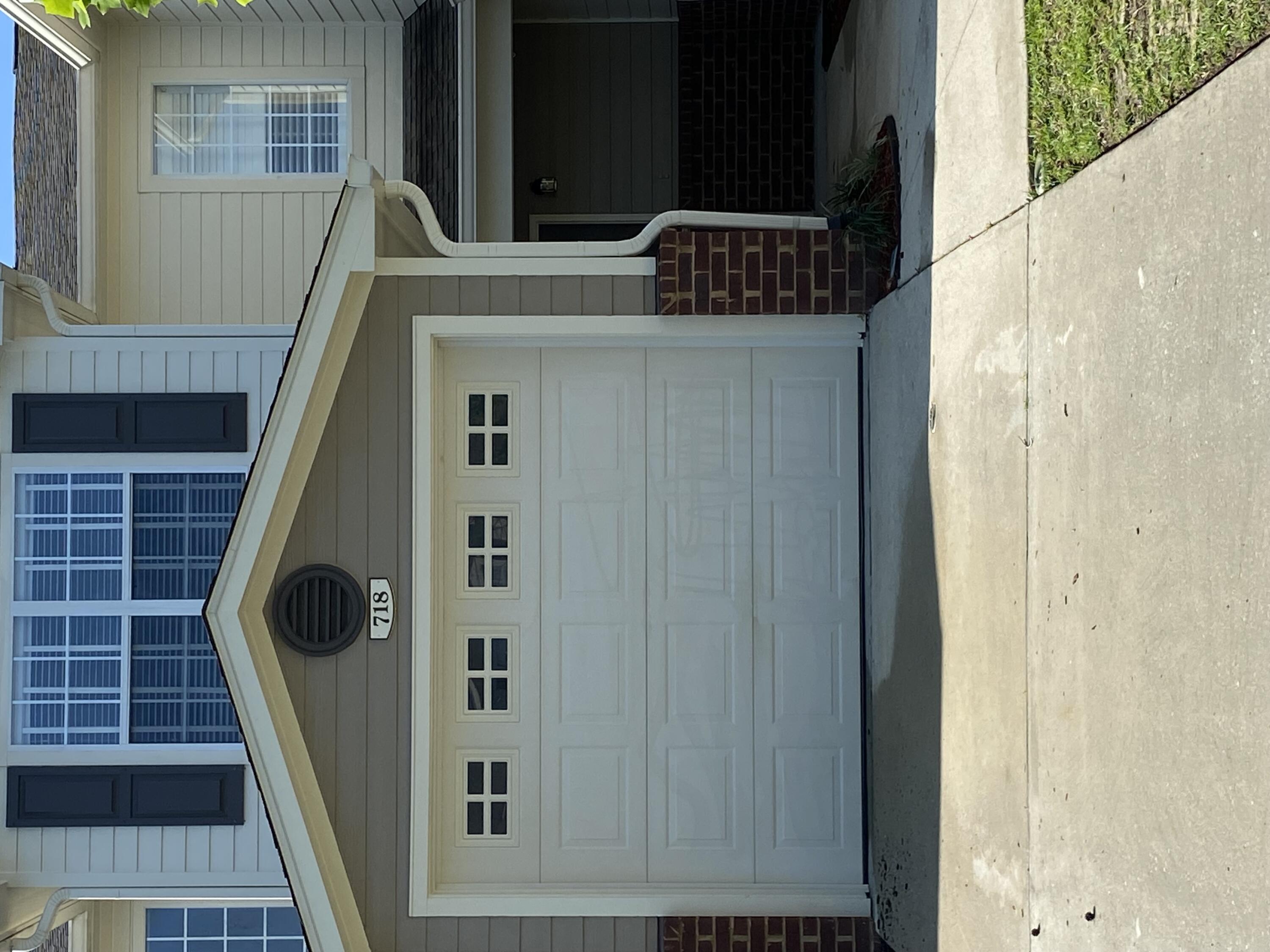 South of I-10. This lovely well maintained townhome is a must see. Located in the very well maintained Eagles Landing Subdivision. This unit offers upgraded wood flooring in the main living area. Upgraded stainless refrigerator and small breakfast bar in the kitchen. Also includes washer and dryer. The two owners suites are located upstairs. Both have their own full bath and walk in closets. There is a community pool and yard service.