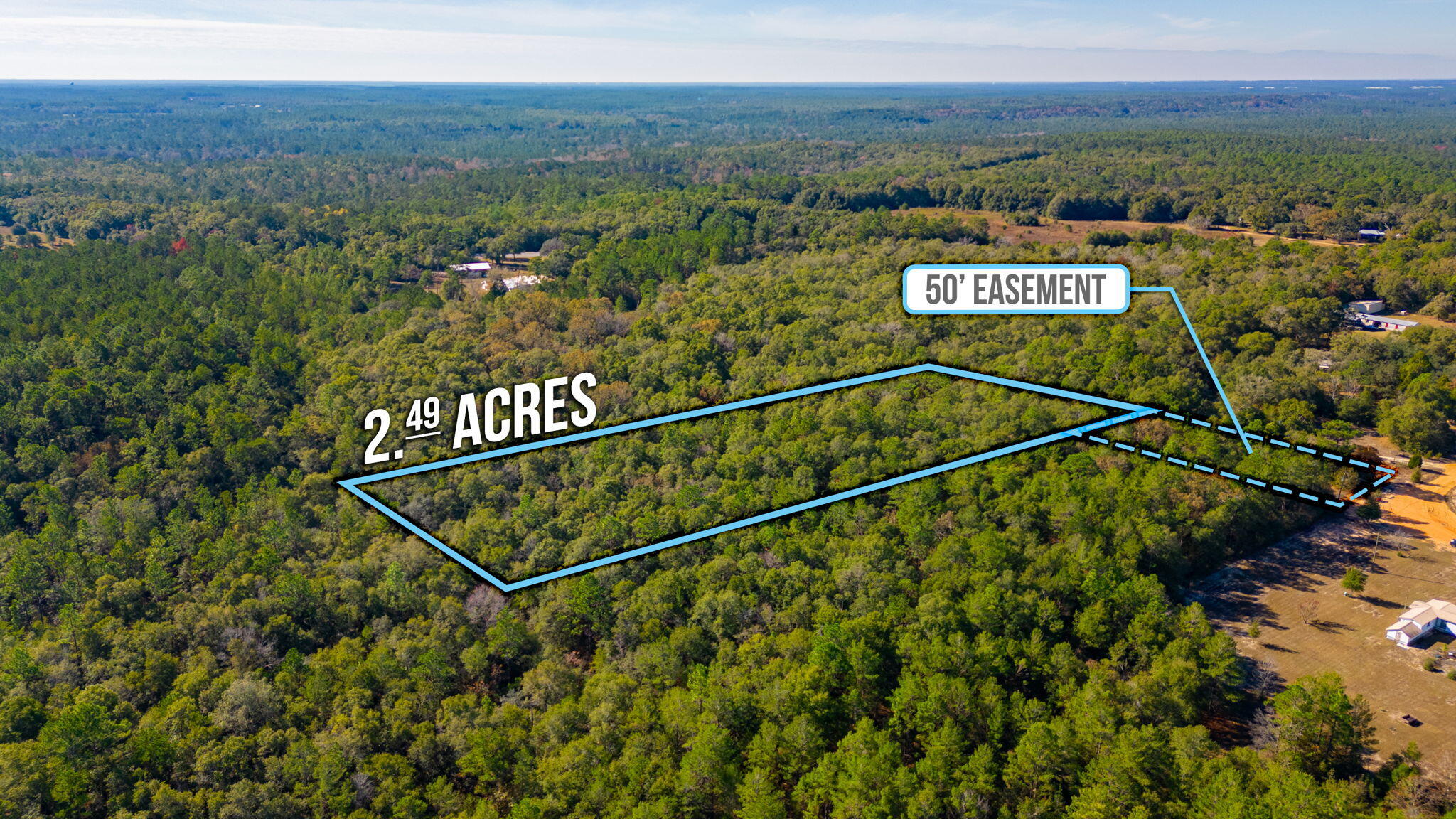 Nestled on 2.49 acres of lush, wooded landscape, this parcel boasts tranquility and privacy on a secluded dirt road, accessed by a 50 ft easement. An updated survey ensures clarity for your plans. While utilities are not currently present, electricity is available at the street but a private well & septic will be needed. Embrace the freedom with no restrictions, welcoming manufactured homes. Experience the allure of country living without sacrificing convenience; a short drive unveils shopping and dining options. Accessibility is key, situated approximately 14 miles from the nearest hospital and less than 30 miles away from Eglin Air Force Base and the stunning shores of the Emerald Coast. Create your dream retreat, surrounded by nature's serenity, yet within reach of essential amenities and sought-after destinations. Don't miss this chance to craft your ideal haven amidst the beauty of this promising landscape. Discover the perfect balance between seclusion and accessibility in this prime real estate offering.
