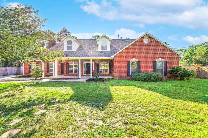 ***An Absolute Showstopper***This is the one you have been waiting for!! OVERSIZED corner lot that has been NEWLY FENCED in Holley By the Sea. This 4 bedroom 3 bath house has ALL the upgrades!! To begin, there is a STUNNING kitchen with GRANITE, white cabinets and STAINLESS appliances. The main floor is wood plank tile and HARDWOODS in the bedrooms. The master bath boasts a HEATED FLOOR and custom TILE shower and Jacuzzi tub. This OPEN CONCEPT house centers around a wood burning FIREPLACE. There is a  2nd story bedroom with 3/4 bath, wet bar and separate entrance! It is perfect for an in-law, young adult or a tenant. This house has a GAS TANKLESS water heater, an 18 SEER AC, & brand new leech field. There is a side yard with a DOUBLE GATE, play-set, zip-line, TOO MUCH TO LIST! MUST SEE!