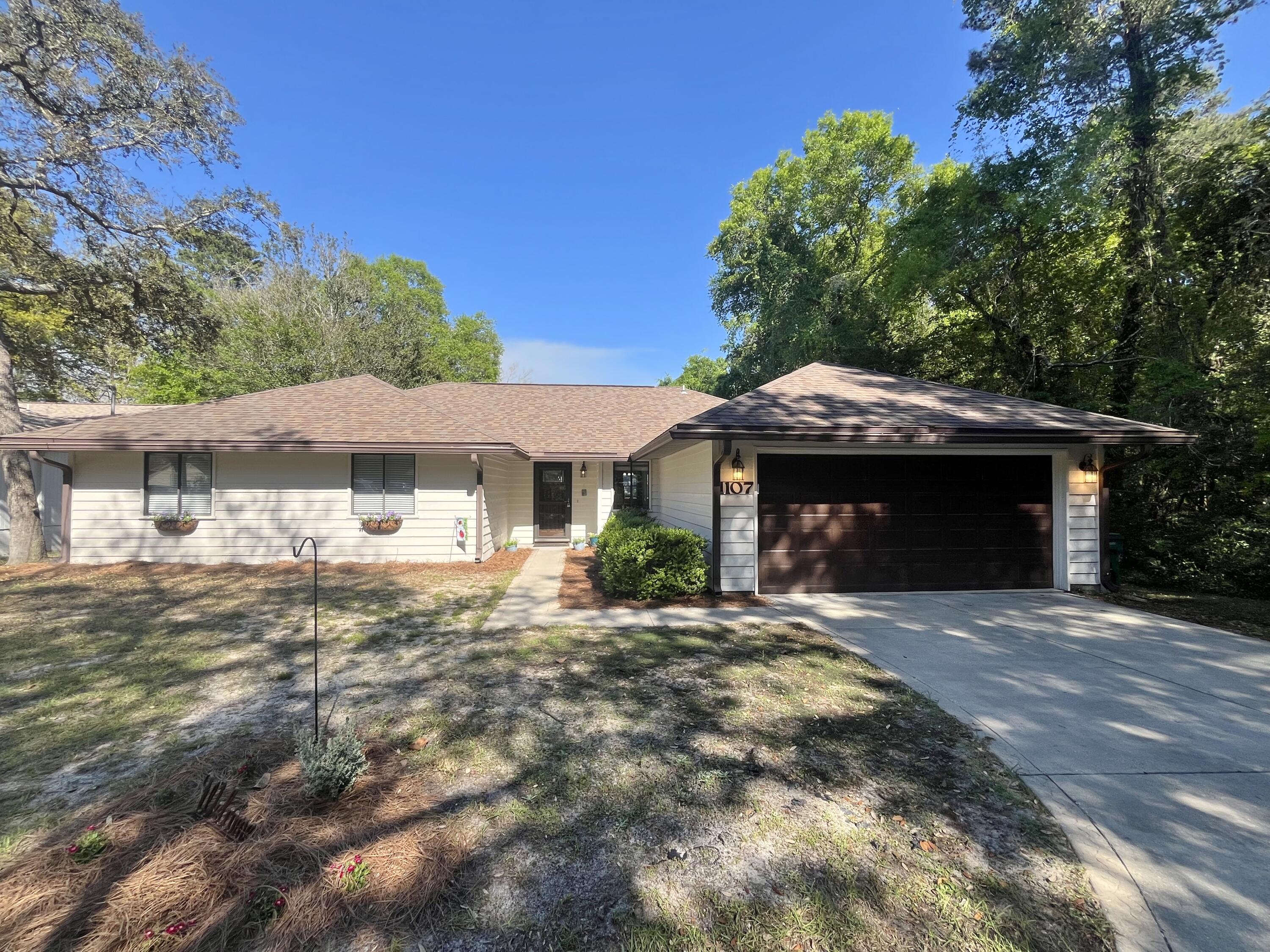 Refreshing traditional style pool home in the heart of Niceville! Nestled on a quiet cul-de-sac, this inviting 3 BDR, 2 bath home blends classic Southern warmth with modern updates. Step inside to the living room with its vaulted ceiling, tiled fireplace and new LifeProof scratch and water resistant, kid and pet friendly, plank flooring. The kitchen is the heart of this home, with granite countertops, cozy breakfast nook, bay windowed dining area, and breakfast bar offering additional room for hosting parties or everyday roomy living. The bonus room off the kitchen is a delightful surprise offering additional space for an office, but also extends to a cozy bunk bed space, ideal for guests, kids, or your own private retreat. Step outside to a freshly painted, wraparound deck overlooking the enticing in-ground pool with brand new liner-ready for endless summer fun. This home also features a sprinkler system, 2 car garage with pull down-stairs and attic storage, plus a new electrical breaker box and the roof was replaced in 2018 for peace of mind. FULL of character, functionality and FUN-come out and see this home today and you will fall in love!