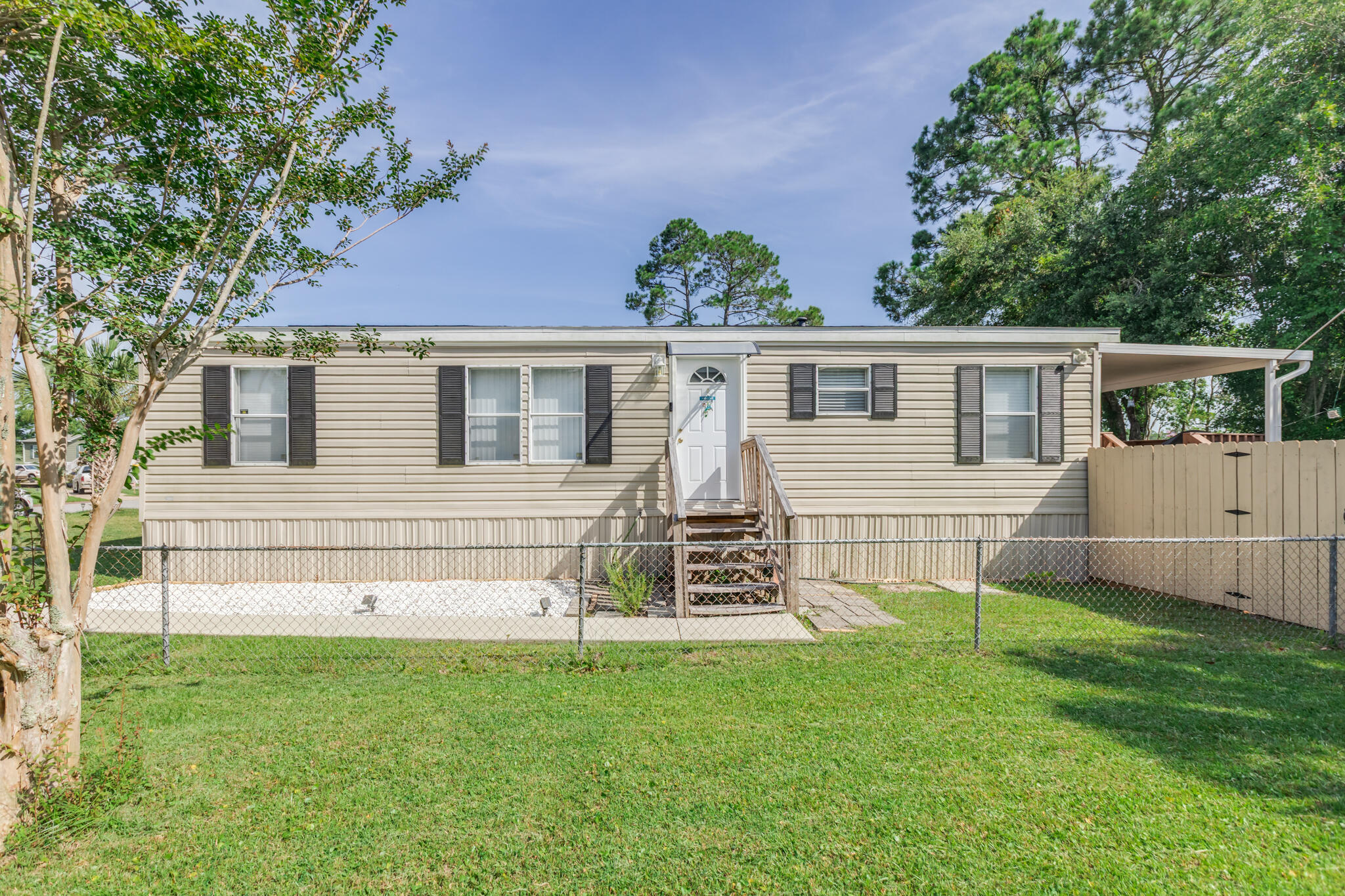WELCOME to 2513 San Juan Grande! a charming yet modern style home nestled in the highly coveted Bayou Grande Villa community! Whether you're a fishing/boating enthusiast, looking for a lucrative rental opportunity or searching for your first home, this property offers an ideal blend of functionality, comfort, and coastal appeal! This unique community offers resort style amenities such as a boat ramp into the beautiful Bayou Grande, gated boat and RV storage, dock - designed for water lovers in mind, a community pool and a clubhouse. Located just 5 minutes from the Naval Air Station Pensacola - home to our beloved BLUE ANGELS! which whom you will get to see often being close by! and a very short drive to Downtown Pensacola, shopping, and our beautiful white sand beaches!