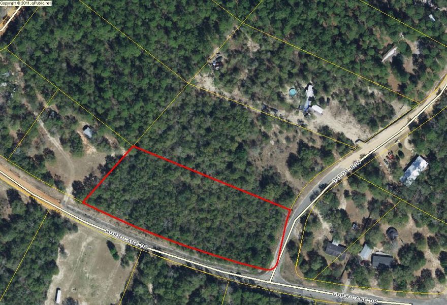2.16 acre lot with city water available, corner lot with frontage on Gator Run and Hurricane Drive. Build that new dream home or place a new manufactured home.