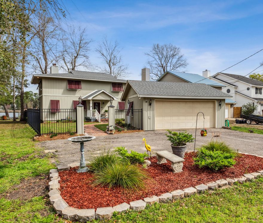 Welcome to this waterfront Gem in Avalon Beach! Situated on Mulatto Bayou, with convenient access to Escambia Bay, just a boat trip away from The Gulf of Mexico. This unique property features a detached 2 car garage, perfect for storing all the water toys with pathways on either side of the home to your back deck area. Through the front door, you find real hardwood floors throughout, leading you straight into the grand dining room that features a wood burning fireplace, quaint shelving built-ins in the rustic wood-lined walls, and great windows with water views. The oversized kitchen has updated appliances, an island, and a breakfast nook. Downstairs, you also have 2 bedrooms, 1 bathroom, and the living room that has a gas powered fireplace and french doors to the back deck...