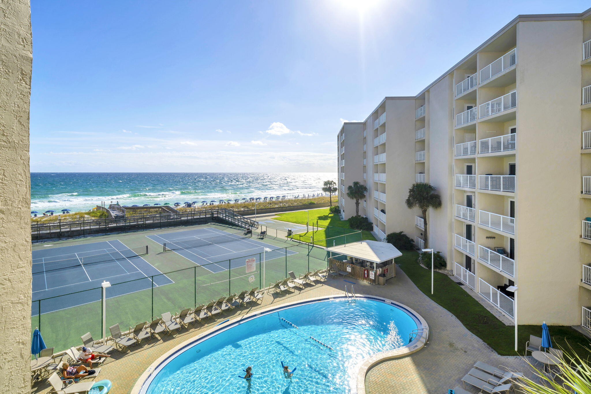 DIRECT GULF FRONT UNIT! Enjoy breathtaking Gulf views from this 4th floor beautifully remodeled 2-bedroom, 2-bath condo at the iconic Holiday Surf and Racquet Club on Holiday Isle in Destin. This is a turnkey rental .The Gulf-facing primary bedroom offers stunning views, while impact-resistant doors and windows provide superior hurricane protection--no shutters needed.The condo features an updated kitchen with granite countertops and glass tile backsplash, renovated bathrooms including a walk-in shower in the primary suite, a built-in dry bar, and tile flooring throughout. Holiday Surf recently completed its 25-year Milestone Inspection with no issues and maintains fully funded reserves for peace of mind.This gated community offers 24-hour security, a Gulf-front pool, tennis courts, fitness and business centers, shuffleboard, and a beach boardwalk with ramp access. Onsite rental management with a proven record is available, or owners may self-manage. Experience Destin's Emerald Coast lifestyle at its best!