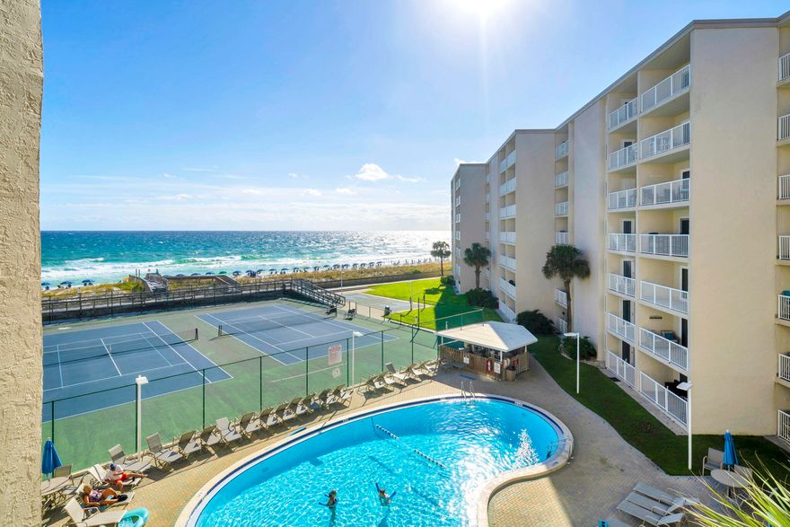 DIRECT GULF FRONT UNIT! Enjoy breathtaking Gulf views from this 4th floor beautifully remodeled 2-bedroom, 2-bath condo at the iconic Holiday Surf and Racquet Club on Holiday Isle in Destin. This is a turnkey rental .The Gulf-facing primary bedroom offers stunning views, while impact-resistant doors and windows provide superior hurricane protection--no shutters needed.The condo features an updated kitchen with granite countertops and glass tile backsplash, renovated bathrooms including a walk-in shower in the primary suite, a built-in dry bar, and tile flooring throughout. Holiday Surf recently completed its 25-year Milestone Inspection with no issues and maintains fully funded reserves for peace of mind.This gated community offers 24-hour security, a Gulf-front pool, tennis courts, fitness and business centers, shuffleboard, and a beach boardwalk with ramp access. Onsite rental management with a proven record is available, or owners may self-manage. Experience Destin's Emerald Coast lifestyle at its best!