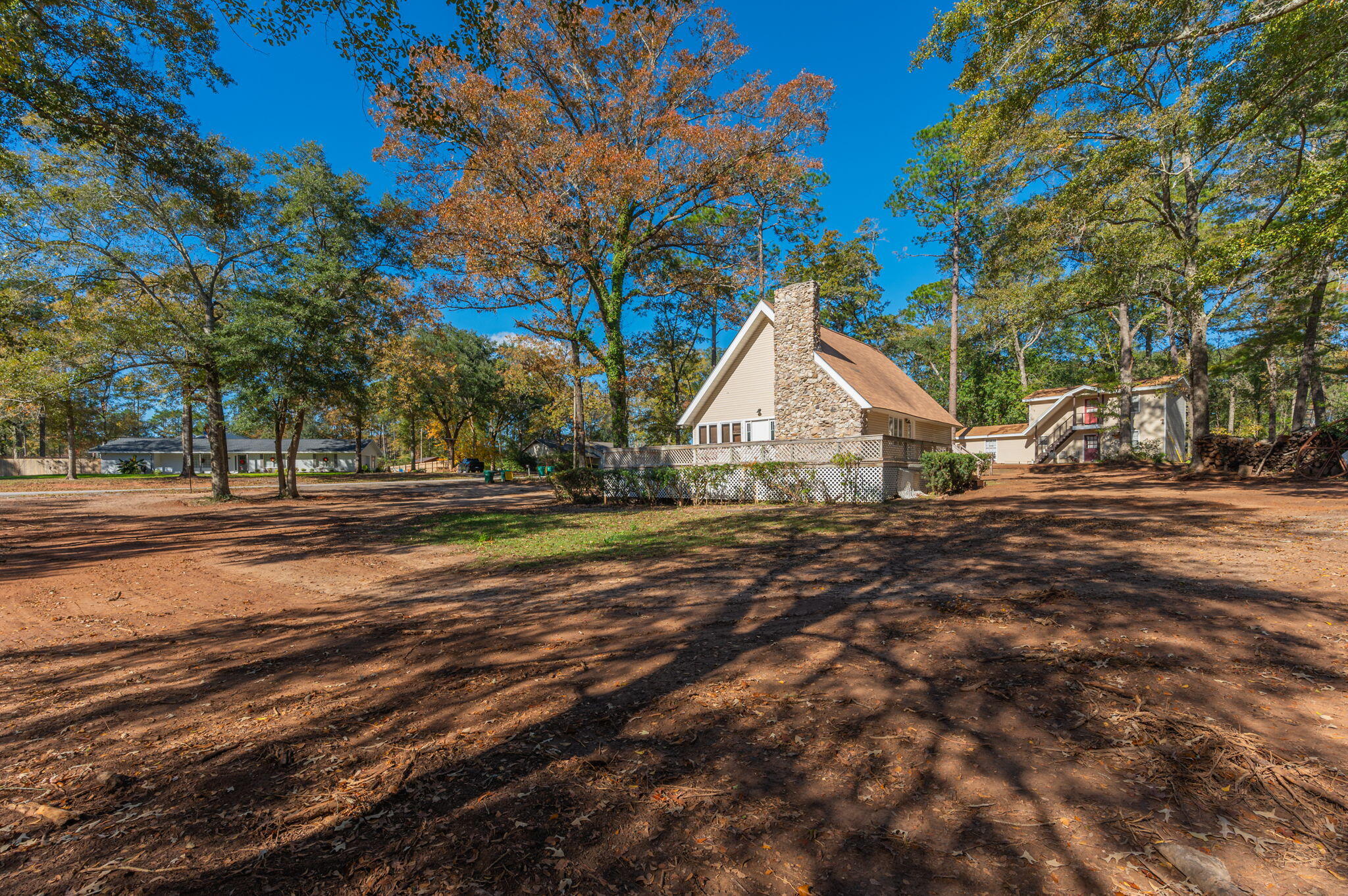 This architectural gem comes with an abundance of character that welcomes you from the moment you arrive. As you step inside, a grand living space unfolds, anchored by a colossal stone fireplace and hearth, creating a warm and inviting atmosphere. This heart of the home serves as the perfect gathering place for cozy evenings and memorable conversations. The charm continues to the upper level, where a snug loft awaits with a bedroom and an adjacent office area, providing both a private retreat and a functional workspace. The design seamlessly blends the rustic ambiance with modern updates, ensuring comfort and style coexist effortlessly. No HOA allows you the ability to park your RV & boat. Roof 2020, Water heater 2024. HVAC duct work replaced 2024.