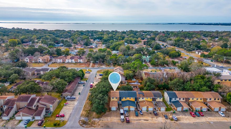 Welcome to your dream townhome! This expertly renovated end unit is a true gem, and is ready for move-in. Say goodbye to the hassle of maintenance. This townhome boasts gorgeous wood-look tile and wood laminate throughout making it easy to clean and maintain. The kitchen is dreamy with new wood white cabinets, real tile backsplash and a clean open concept for a large table. 3 large bedrooms, and 3 baths as well make this spacious for guests! Keyless entry, built-in blinds, and granite counters are just some of the upgrades you'll find. Oversized garage for the cars or toys.  An end unit, this townhome flaunts a double lot and bonus parking too! NO HOA, and proximity to county-maintained ballfields on the street.   Roof is 2020, HVAC is 2016