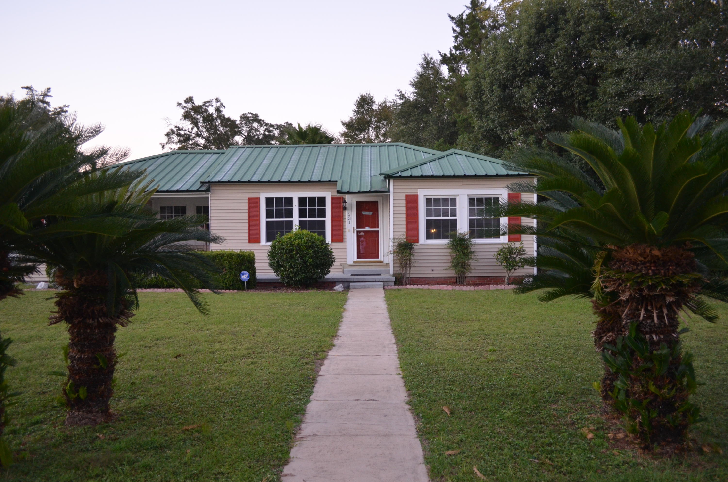 This renovated Florida cottage is in exceptional condition and just a short walk to Lake DeFuniak and historic downtown DeFuniak Springs. Open floorplan in this charming 1940's cottage. Renovations include hardwood flooring in the living room. The kitchen features wooden cabinets, tile flooring, indoor laundry room, pantry & coffee bar. Split floorplan with private master bed & bath beside the den/office. Master Bath has a large tiled bath with a walk-in shower. All bedrooms are carpeted. Very organized lawn with separately fenced dog run, several storage buildings, a covered carport & covered RV parking. All newer exterior windows & doors.