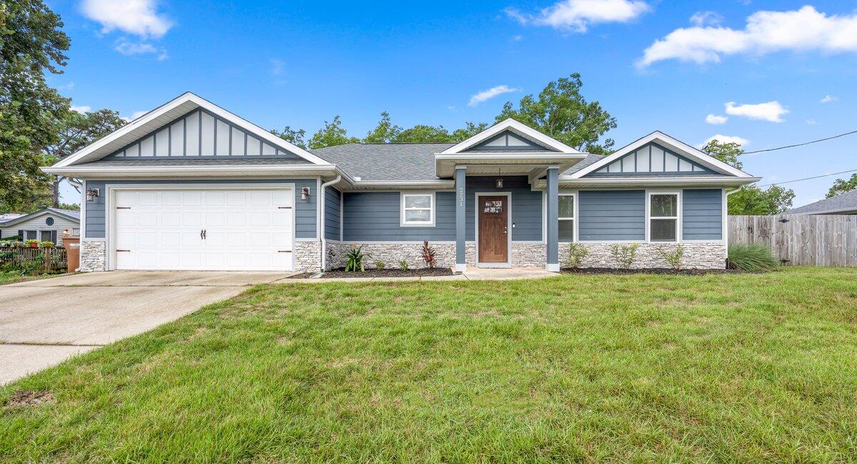 Welcome to this beautifully maintained home in East Navarre, located just a short drive from Hurlburt Field AFB! Featuring an eye-catching exterior with elegant stone accents and durable Hardie Plank siding, this property offers a timeless, low-maintenance appeal. The well-designed split floor plan includes 4 bedrooms, 2 bathrooms, and a spacious 1,763 sq ft of living space. Step inside through the welcoming foyer and into the large, open-concept living area, highlighted by a custom ceiling that adds a touch of sophistication.   Seller willing to offer a 3.5% VA assumable loan.   SELLER WILL PAY SOME OF BUYERS CLOSING COSTS w acceptable offer. The modern kitchen is perfect for entertaining, with
solid wood cabinets, a breakfast bar, stainless steel appliances, a built-in wine refrigerator, and beautiful granite countertops.  

The private master suite serves as a peaceful retreat, complete with an en-suite bathroom featuring a tiled walk-in shower, a separate soaking tub, and double vanities with custom cabinetry. The home's flooring offers the best of both worlds -luxurious, easy-care wood laminate in the main living areas and NEW plush carpet in the bedrooms for ultimate comfort.

Outside, enjoy the large covered back porch and fully fenced backyard, an ideal setting for family gatherings, outdoor activities, or quiet relaxation.

Just minutes away from schools, shopping, and the stunning Navarre Beach, this home combines comfort, style, and convenience into one perfect package.

Don't miss out on this incredible home -schedule your showing today!
