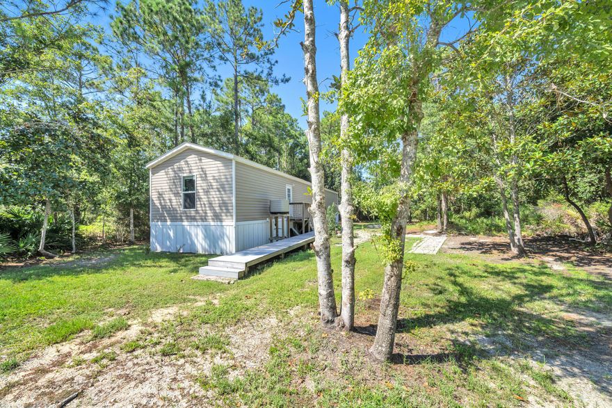 Affordable living in the heart of Santa Rosa Beach!! 3BR/2BA home built in 2017, on peaceful private wooded lot. Very clean and ready for the next owner! This listing includes the vacant lot next door for a deal that can't be passed up!! This parcel is situated close to all that draws people to beautiful Santa Rosa Beach - 8 minutes to the beaches of 30A Ed Walline Regional Beach Access; less than 5 minutes to the Cessna Landing/Hogtown Bayou public boat launch; schools all within 20 minutes drive; 15 minutes to Sacred Heart Hospital of the Emerald Coast; and close to all shopping and dining! Call me today for all the info on how you can secure this low priced property as your home or investment!