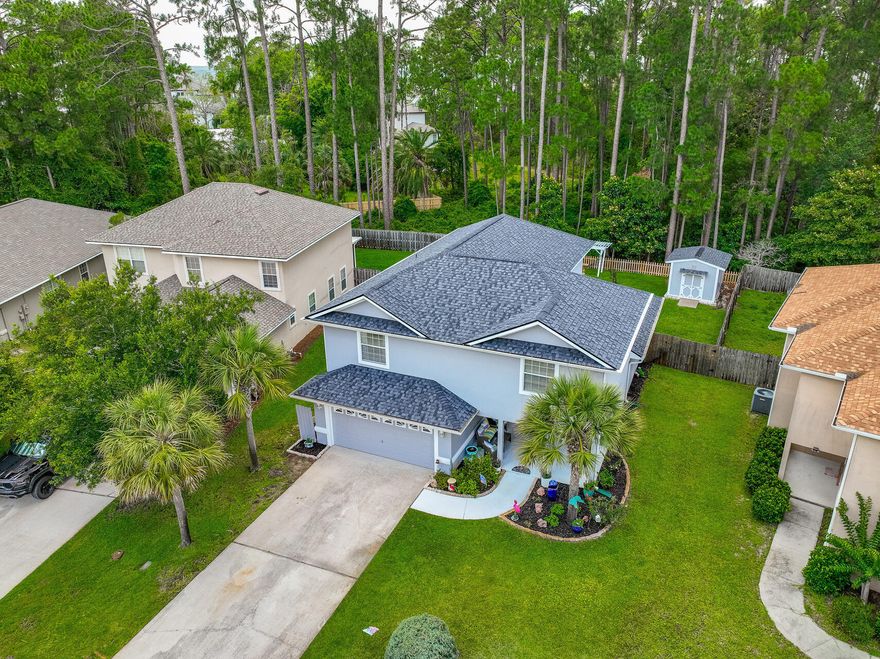 >>>PICTURE PERFECT OUTDOOR LIVING and a meticulously cared for home: Imagine owning your very own private park, complete with a manicured lawn, water feature, arbor, swing, outdoor furniture and FOREVER green views behind you. 520 Loblolly Bay Dr. is outdoor living at its finest. The fully fenced, beautifully landscaped backyard backs up to a nature preserve for neverending peaceful views of lush greenery. The sellers are including all outdoor furniture in the sale.>>>THE SPACIOUS FIRST FLOOR: Enjoy privacy in your first floor Primary Suite with an ensuite bathroom & walk-in closet which is separated from the other bedrooms. 20' ceilings tower above the open concept Living/ Dining/ Kitchen area.