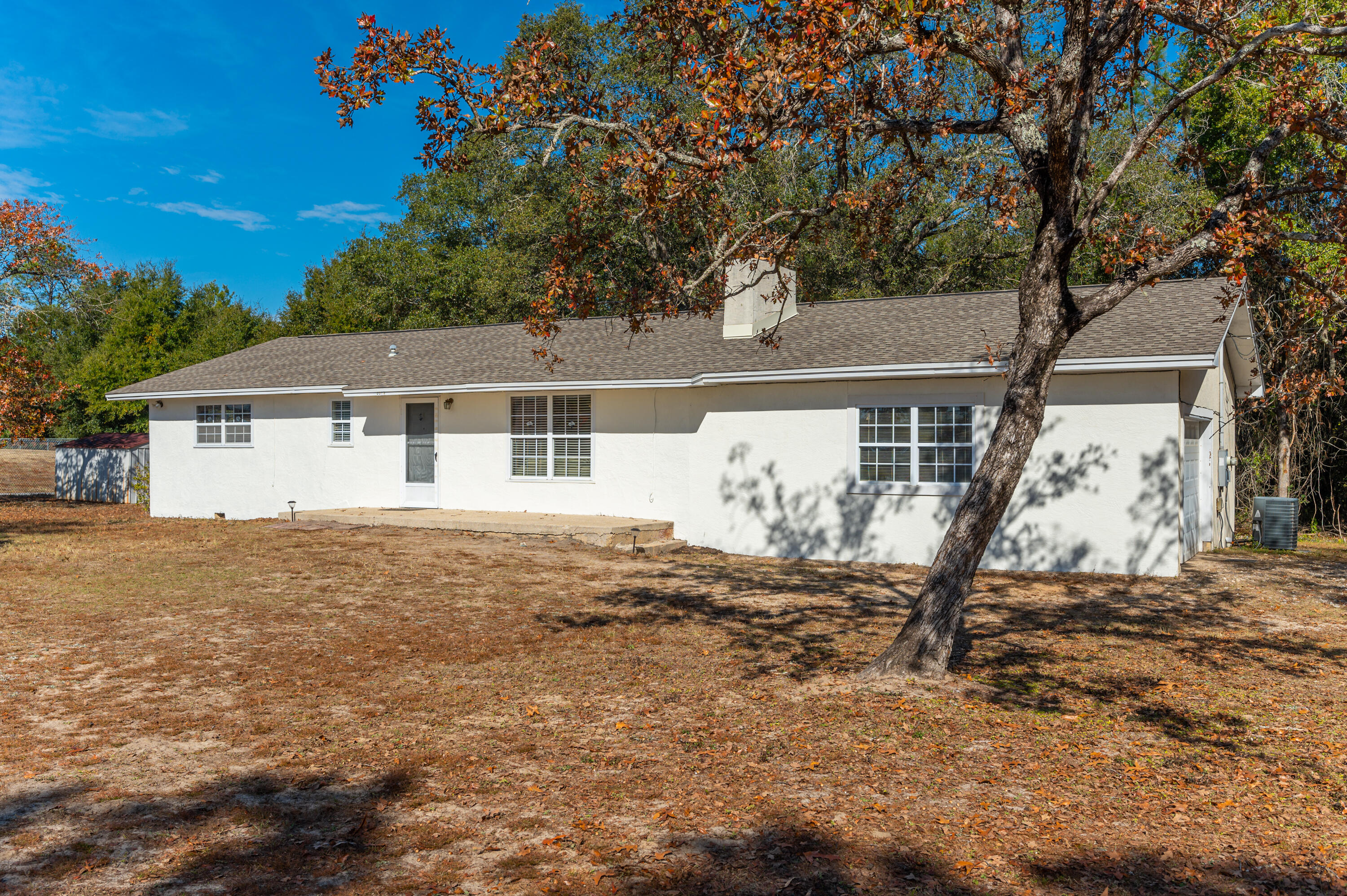 Tons of potential!!! Check out this 3bd/2ba home and acreage located less than 15 minutes from I-10, approx 2 miles to the hospital and close proximity to Riverside Elementary and Shoal River Middle School. The home features laminate and tile flooring. Spacious living room with a stone fireplace and a functional kitchen. Kitchen appliance all convey (But the dishwasher don't drain properly). The roof is approx 5 years old, AC was replaced around 2017, and the water heater was replace around 2019. Property is being sold in AS IS condition! The property is currently zoned residential. Buyer to verify all areas importance!