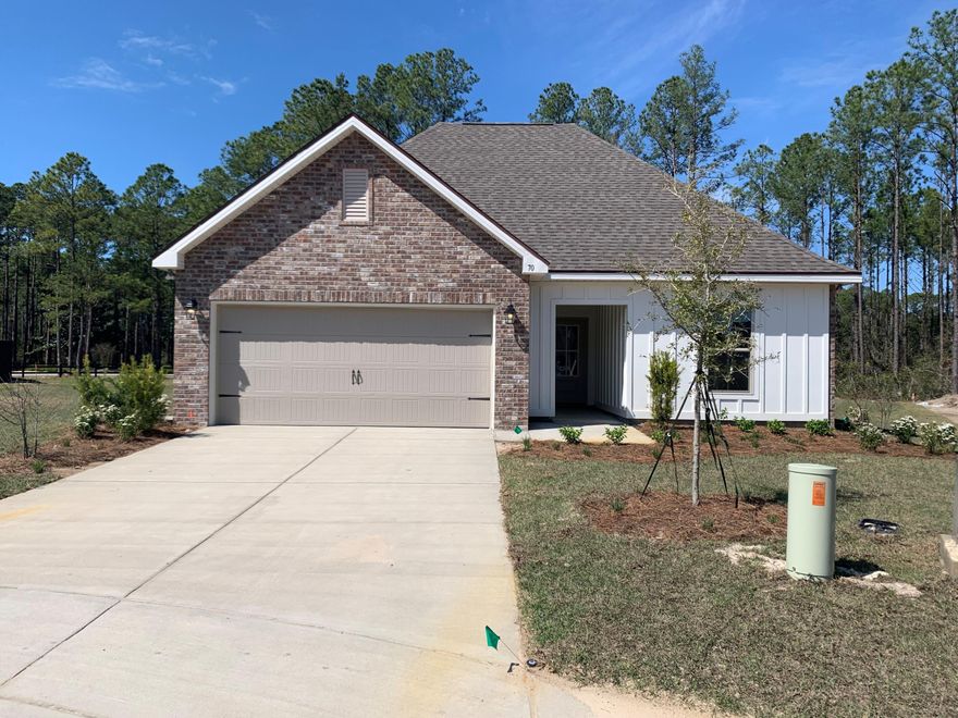 Located on a cul-de-sac lot the NOLANA IV G in Moonswept at Hammock Bay community offers a 3 bedroom, 2 full bathroom, open design.  Upgrades added (list attached).  Features: double vanity, garden tub, separate custom tiled shower with frameless door, and walk-in closet in the master suite, covered front porch and rear patio, recessed lighting, crown molding, kitchen island, walk-in pantry, undermount sinks, framed mirrors, smoke/carbon monoxide detectors, landscaping package, architectural 30-year shingles, flood lights, and more!Energy Efficient Features: water heater, kitchen appliance package, vinyl low E windows, and more!