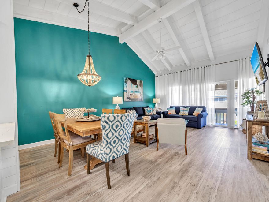 Beautifully remodeled condo directly across the street from the sugar sand beaches.  Turnkey and ready to go.   Renovated bathrooms, kitchen,  new LVP flooring and full size washer and dryer.  New SS appliances, farmhouse sink, all new furniture and 3 new LG TVs.   New HVAC  in 2023 inside, outside unit new in 2019.  All new plumbing in baths and kitchen with new garbage disposal and new full size washer and dryer.  Shiplap wall in the Dining Room.  Vaulted wood ceilings creating a spacious and open feeling.  Amenities are numerous including a heated pool in the winter, pickleball courts, tennis courts, BBQ grills and a community room.
