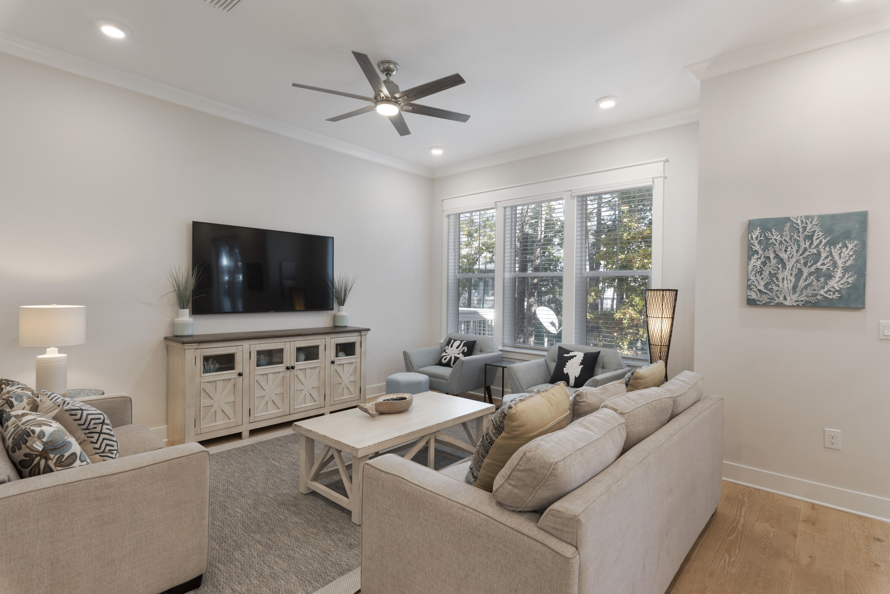 Upgrades abound in this impeccably designed 3BR/2.5BA beach retreat in the highly sought after community of Prominence North on 30A. With a prime location in the back of the neighborhood, this home is adjacent to a large open green space and was one of the final triplexes completed in 2019 in Prominence North. As a result, this home features all the builder designer upgrades including, stainless Electrolux appliances, quartz counters and farmhouse sink, painted kitchen island, rain shower faucets in master shower and expanded open deck overlooking wooded area for added privacy. Newly installed shiplap accents the main level and leads up the stairway to bedrooms on the second floor. Open concept coastal chic living/dining area is inviting with plenty of space for all to spread out. Dining area accommodates six, with additional seating at the oversized kitchen island.French doors lead from the living area to an open deck overlooking wooded pine lands adding to the privacy. All bedrooms are on the second floor including two generous guest rooms - one with a queen, one with two sets of bunks  and an elegant light-filled master suite with soaring windows, vaulted ceiling and private ensuite bath with dual vanities and glass enclosed shower. This fully furnished ''Bahamas'' plan 3-bedroom townhome in Prominence is turn-key ready for immediate rental income or personal enjoyment. An attached two car garage with newly upgraded epoxy floors and additional storage closets adds convenience and functionality. 

Prominence is a bustling beach area adjacent to Watersound Beach on 30A with both single family and charming townhomes. Amenities include private seasonal shuttle service to beach, two resort-style community pools, green space and fitness center. The community is conveniently located across the street from the hottest entertainment center on 30A at The Hub and within a short bike ride to world-class dining, shopping and entertainment of Rosemary, Seacrest and Alys, Seaside and Seagrove Beach. If you've been waiting for the perfect 3B/2.5B townhouse in the sought after community of Prominence North, this is it! With strong rental history and projections on target to generate well over $80K in gross rental income, this home makes the perfect vacation home or rental investment property. 

Bikes convey with the sales of this home. Newly serviced, six-seater golf cart can be sold separately or negotiated in sale. Fully-furnished with a few small exclusions noted in documents.  Don't miss the opportunity to own your slice of paradise on 30A. 
