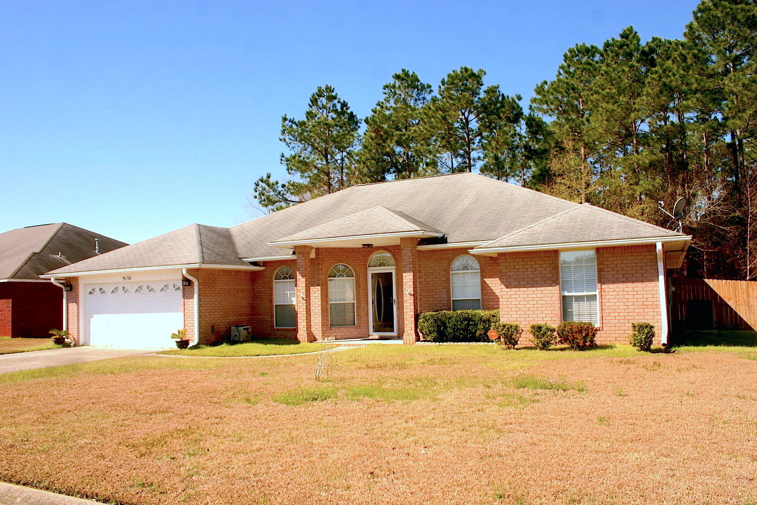 You've found it! This spacious 4 bedroom, 3 full bathroom home with office in Lillian Woods subdivision is close to military bases, schools, and beaches. All of the extras include a new HVAC System, privacy fence, protective Kevlar style wind protection coverings, large raised outbuilding for extra storage, split-bedroom floor plan, fireplace, and screened patio. Large master bedroom, master bathroom with double sinks/garden tub/walk-in shower, and walk-in closet. Home features a formal dining room, yet has an eat-in kitchen area for informal dining. Kitchen boasts a french door refrigerator with chest freezer, gas oven/stove, dishwasher, and microwave. Perfect for large or small family. All this home needs now is a new family!