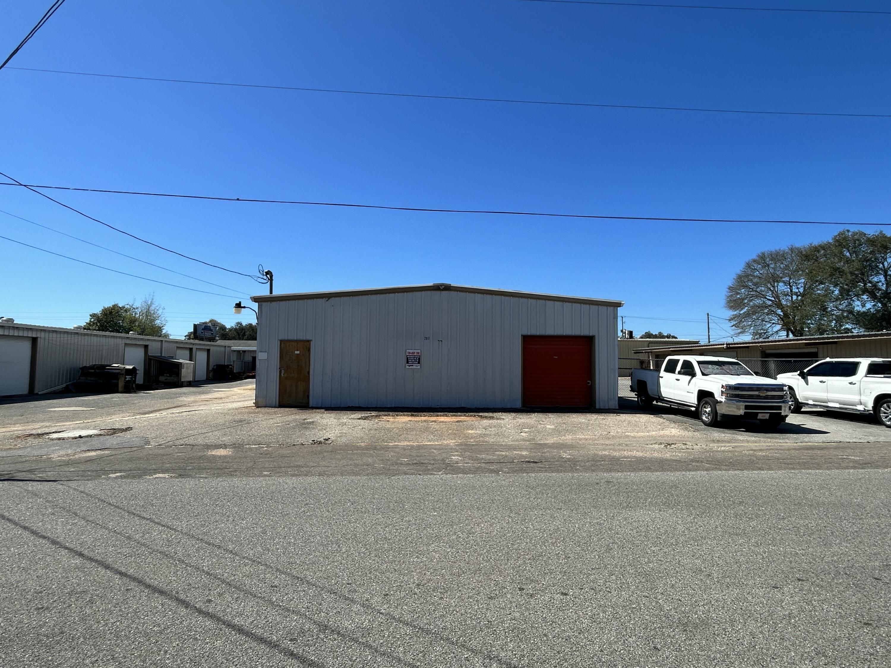 Truman Street Warehouse Park is a well-established warehouse property featuring a 5,200 square foot flex warehouse space with 636 sqft of heated and cooled office space and bathroom.