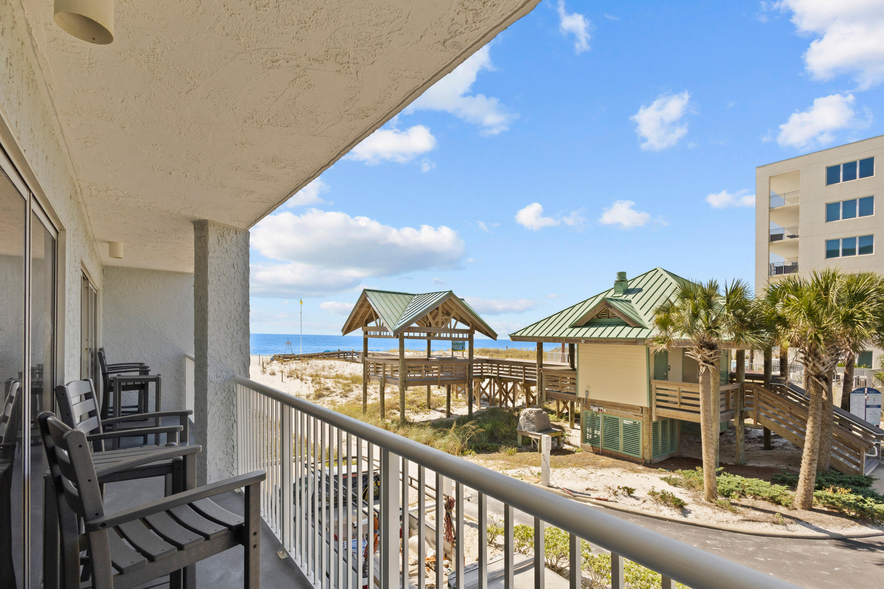 Private balcony with stunning views of Gulf of Mexico and white sandy beaches. This is one of the highlights of the unit, providing a serene getaway! Unit 206 has 2 bedrooms w/king size beds and smart TVs. Living area has a smart TV and a queen-sized Murphy bed (cabinet). 2 bathrooms makes this unit ideal for small families or groups; 1 bath has shower only, the other bath has a tub/shower combo. Laundry room with full sized washer and dryer.  Seller offers fully furnished and turn-key ready for your convenience! Islander is a beachfront condominium located on Okaloosa Island, part of the beautiful Emerald Coast in Florida.  20' x 80' heated pool w/ restroom, shower area and access lift for guests needing assistance. ~ Event Venue/ community room ~ BBQ grill area~ Shuffleboard court~