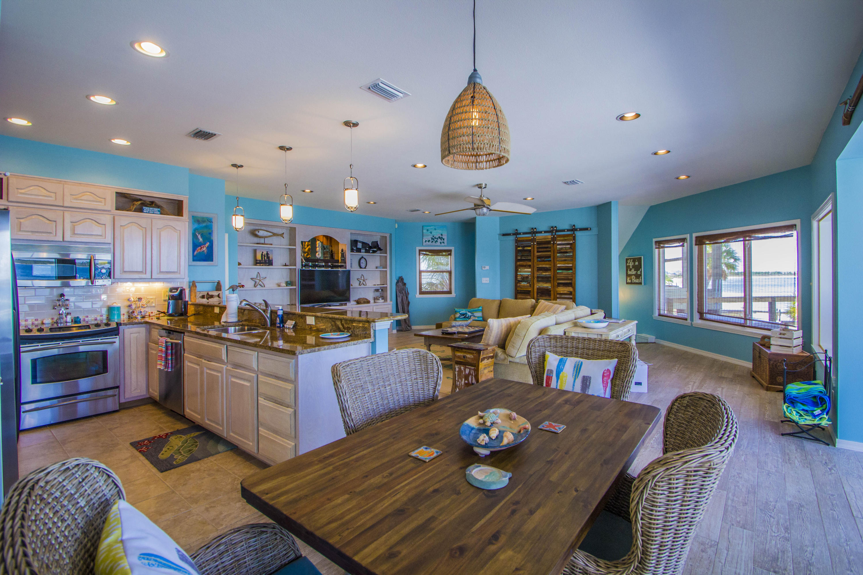 Newly renovated gorgeous home on the sound! Family purchased home and completed renovations to enjoy as their family beach home, but they don't have time to come down to enjoy it. There is a new pergola on one of the new balconies and there are floor to ceiling hurricane impact windows for an amazing panoramic view of the sound. This home has it's own private beach, private dock and boat lift. The downstairs has a bonus bedroom and bathroom with a living space that opens up right outside with an easy push of a garage door. The main living space on the second floor has a very large open floor plan and a great entertaining space and new wood style tile throughout.Homeowners, Wind, and Flood Insurance:Total for all 3 is $5,342.00