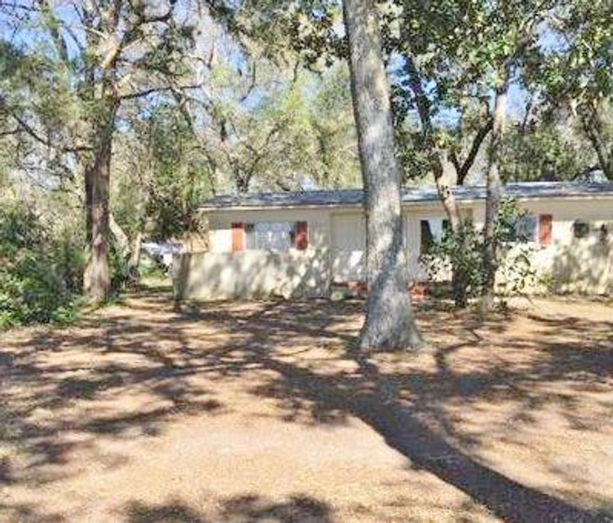 REO - Handyman special 3/2 old Florida style residence situated on over an acre of wooded land w/beautiful Choctawhatchee Bay views! Don't miss the opportunity to own one of the few remaining large parcels in this area. The split floor plan home offers hardwood flooring, a large Family room, cozy living room with fireplace and wood beam ceiling, skylights, an eat in kitchen with solid surface countertops & ample wood cabinetry & a screened lanai with breathtaking views. All Info recorded in MLS is intended to be accurate but not guaranteed, buyer advised to verify. Sold As-Is. No utilities will be turned on to this property & only cash/renovation loan offers w/0 day inspection period will be considered. Buyer should perform due diligence/necessary inspections before submitting an offer.