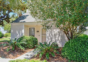 Enjoy the best of resort living or use as a short-term rental. This 3BD/3BA two-story cottage is in the heart of Sandestin Golf & Beach Resort. Interior upgrades add comfort, style, and rental appeal. The open floor plan features spacious living and dining areas, plus an updated kitchen with granite counters, ample cabinetry, and a breakfast bar. The main floor includes a bunk room, full bath with walk-in shower, storage closet, and under-stair storage. Upstairs offers a primary suite with walk-in shower, a second bedroom, full hall bath, laundry closet, and two private balconies. Enjoy cozy time in the screened in porch or the back patio. There is also a large outdoor storage closet. Quiet cul-de-sac just a few steps from walking and biking trails. Short ride to beach. Community tennis courts, marina, Baytowne Wharf, multiple pools, and 4 championship golf courses. Whether you're looking for a primary home, vacation getaway, or income-producing property, this Sandpiper Village cottage offers the perfect resort lifestyle.