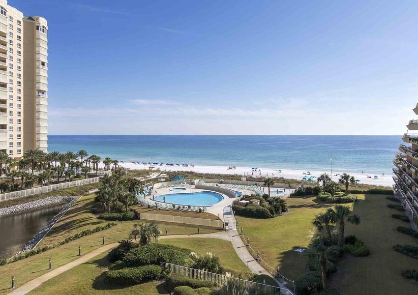 MAGNIFICIENT VIEWS OF THE GULF, BEACH AND COASTLINE from this 7th floor one bedroom, one bath condo in the popular community of Edgewater. This unit has a large balcony offering extra outdoor living space while enjoying the breathtaking view of the emerald water. Balcony can be accessed from both the living area and bedroom. The condo is upgraded with granite counter tops in kitchen and bathroom. Nice tile floors in living room and kitchen with carpet in the bedroom. Edgewater is a gated community offering many amenities including 420 feet of private beach, covered parking, two beach side pools (one is being heated), waterfall spa and wading pool, fitness center, game room and children's playground, putting green, shuffleboard area and basketball court. Walking