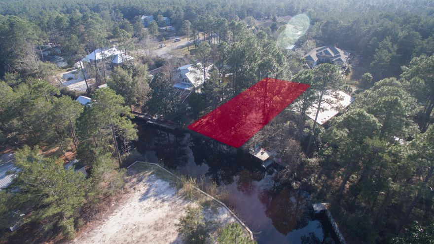 This waterfront lot is on a deep water canal that leads to the Choctawhatchee Bay and The ICW (Intercoastal Waterway). The Daughettes in Point Washington is just 5 minutes to the sugar white beaches of South Walton and all the world class restaurants, unique shops, galleries, outdoor concerts and art festivals that Scenic Hwy 30A has to offer. All that is available and the Daughettes offer very low traffic and a small neighborhood feel. This homesite has no HOA fee's and no required build out time. There is driveway and privacy fence in place.
