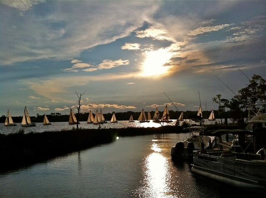 Beautiful Bay Views... watch the sunset every evening from your back porch. Bluewater Marina, Schooners Oyster bar and restaurant just a quick stroll away.Beautifully updated with LVP flooring throughout, granite counter tops. Owner has had the crawl space sealed and added 2 de-humidifier's, one in the crawlspace and one in the house. Come take a look and you wont be disappointed!