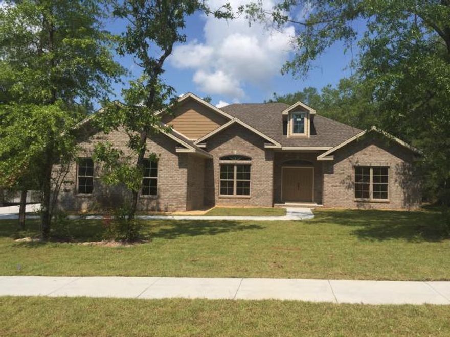 This home is perfect for entertaining! Walk in and you are greeted with high ceilings and running hard wood flooring throughout the open living and formal dining area. The kitchen has plenty of cabinet space, new stainless steel appliances and an eat-in kitchen area. Plus, the walk-in pantry is huge! This home is a split floor plans with the master bedroom directly off of the kitchen. It is a spacious living area with dual sinks, a walk in stone shower, and a deep soaking tub to relax after a hard day of work. Enjoy a drink on your screened in patio and look over your peaceful half acre lot. Come grab a little peice of of the outdoor Florida lifestyle!