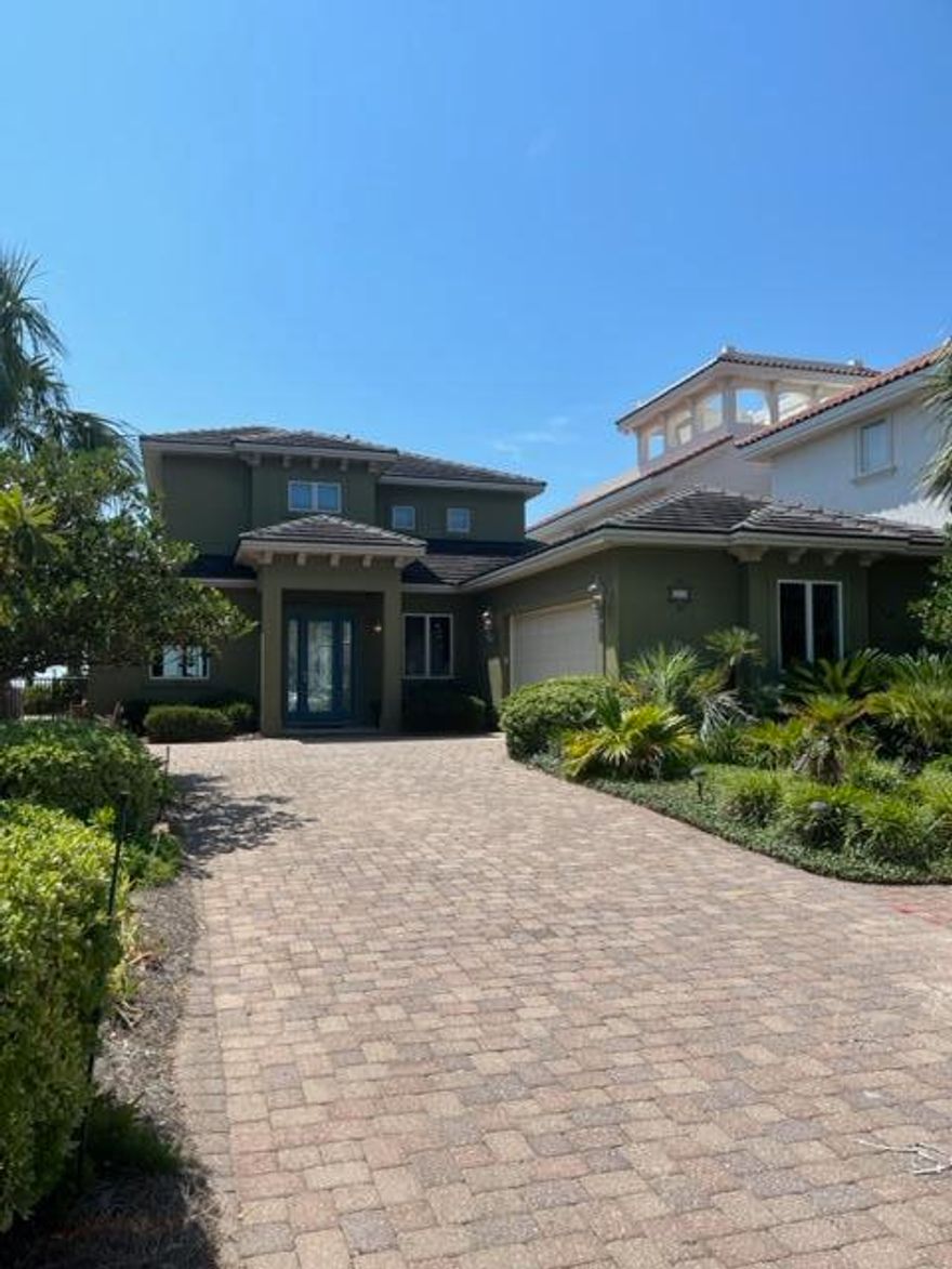 Coastal Living at it's FINEST. LOCATION LOCATION!! This Exquisite Gated Waterfront Home will Knock Your Socks Off. Ten Foot Ceilings throughout the Lower Level with Triple Crown Moldings. Elegant Great Room and Top of the Line Chef's Kitchen with Views to Die For! Ground Floor Master Bedroom Suite with very Tasteful Upgrades. Seller also added a Bedroom on the Main Level along with a Half Bath.  Double Sliding Glass Doors Lead you to the Inground Covered Pool, Outdoor Kitchen and Patio Area. Upstairs has a Bonus Loft/Living Room for the 2 Additional Bedrooms and Full Bath. Bonus Area leads out to the Balcony where you will enjoy Sunrises and Sunsets Over the Bay! Oversized Separate Laundry Room. Home has had a Pre-Listing Inspection With any Issues Addressed. Come See and Fall in Love.