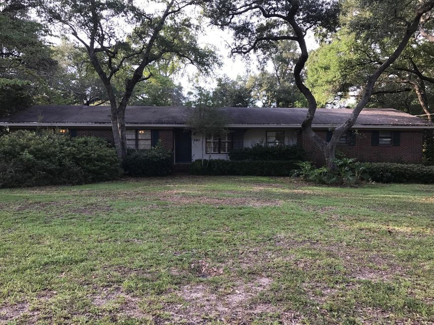 This MOVE-IN-READY, LOVINGLY-CARED-FOR, all-brick, 3-2 home is in a quiet neighborhood just a short walk to Florida Park, Lewis Middle School and less than a mile to Eglin's East Gate. The home sits on a huge oak-covered private double lot 150' wide and 150' deep. The home features a renovated kitchen (open to large family room/den)with granite countertops, oak floors and tile baths. Major renovation in 1996, new cabinets, electrical receptacles, interior doors, crown molding, baseboards, outlets, tile flooring and oak floors were refinished. New faucets in bath 3 years ago. Enjoy the private view from your shaded deck or spend some time in your large detached workshop (17 X 29). Very well maintained. Buyer to verify all information.