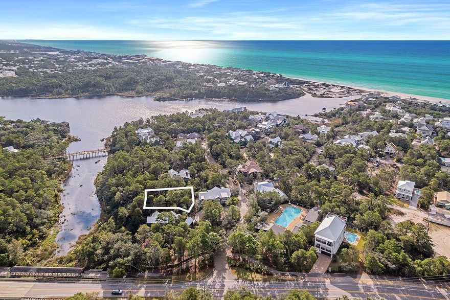 Positioned within the serene embrace of Draper Lake Coastal Village, this lot offers a unique blend of natural beauty and community charm. With lake frontage and a strategic position near the entrance, it stands out as a sizeable and well-shaped piece of land in Draper Lake Coastal Village. Surrounded by lush greenery and a network of trails, it's a haven for those who find solace in nature's lap. The lot is heavily wooded, enhancing its privacy and tranquility. This spot is ideal for building a primary or secondary home, with a community ethos that values long-term residency over short-term rentals. Draper Lake Coastal Village residents are privy to a suite of exceptional amenities. These include two swimming pools, dual boathouses equipped for kayak and paddleboard storage, and meandering nature trails. An observation tower offers panoramic views, while private parking near beach access adds convenience. The community's proximity to Blue Mountain, Gulf Place, and Grayton Beach means a plethora of dining and shopping options are just a stone's throw away. Adventure seekers can kayak or paddleboard directly from Draper Lake to the beach. In a commitment to preserving the natural environment, the community ensures that land within the first 100 feet from the lake's edge remains undeveloped, offering unspoiled pedestrian access to the water through scenic hiking trails. This lot is more than just a piece of land; it's a gateway to a lifestyle in harmony with nature and community.
