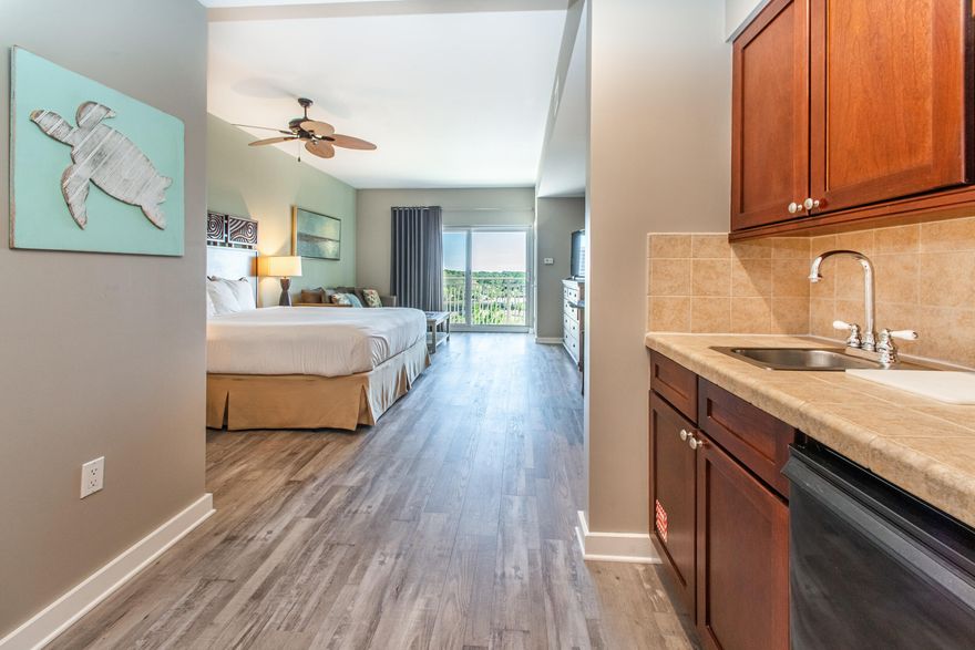 Are you ready to enjoy the resort lifestyle with your own beach condo? Located in the prestigious Sandestin Resort- Luau is the place for you. Luau is a three minute walk to the famed beaches of the Florida Gulf coast. This condo has been updated with new LVP flooring, is fully furnished and rental ready. This turnkey property is primed for rental opportunities, catering perfectly to couples, business travelers, golf enthusiasts, and young families alike. The well-appointed layout includes a spacious king-sized bed and a convenient sleeper sofa, ensuring comfort and versatility for all guests. The Luau offers a sprawling pool with waterfall, hot tub, fitness center, and an inviting grilling area. Buyer to verify all dimensions.