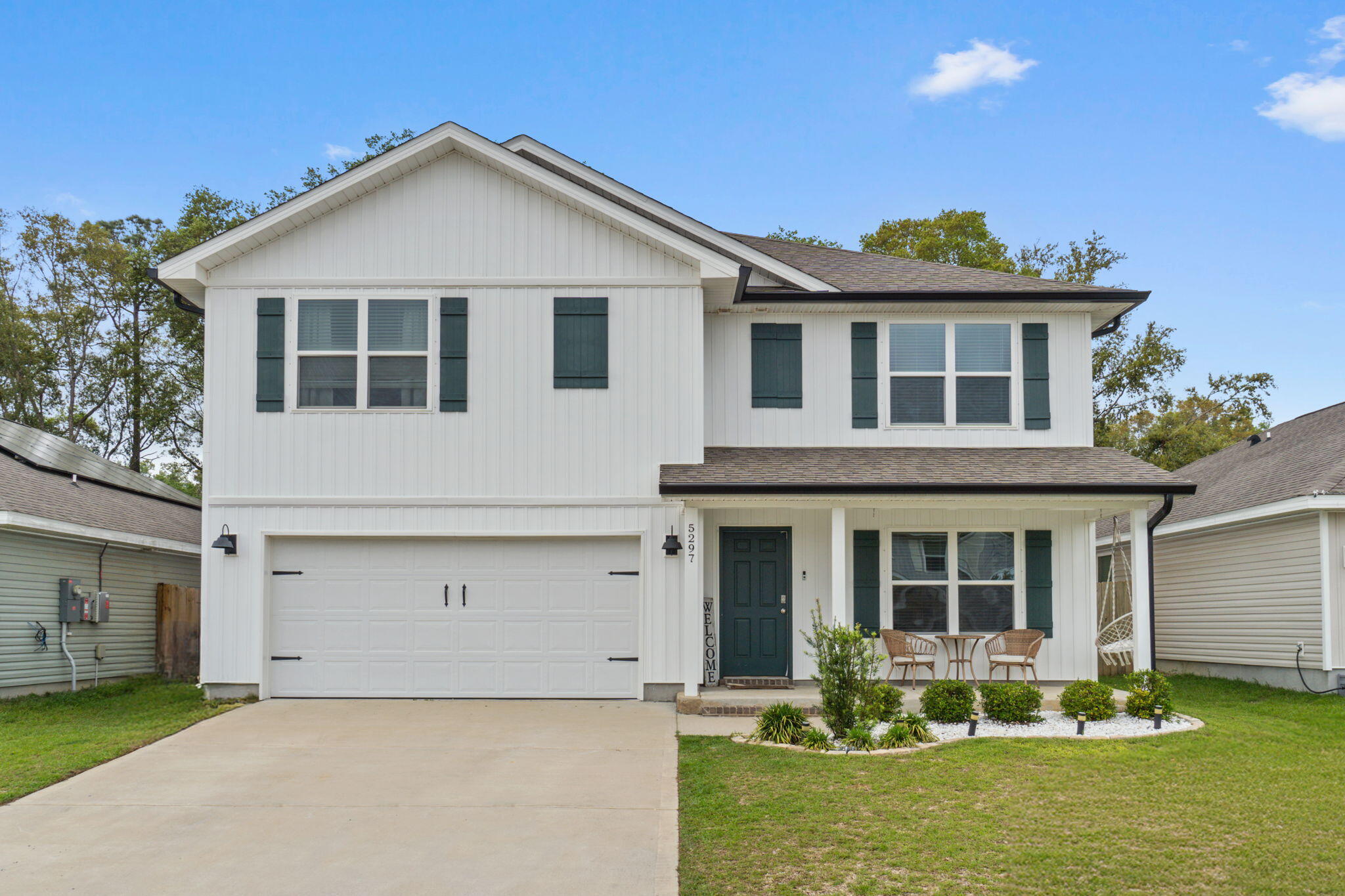 Welcome home to this fantastic 5 bedroom (plus an office AND upstairs loft/living room!), 3 bathroom home located in the popular neighborhood of the Woodlands centrally located in Pace and minutes from I-10, Hwy 90, NAS Whiting Field, UWF, shopping, restaurants, and the Emerald Coast's beautiful beaches. Pull into the community and you're greeted with sidewalks, street lighting, underground utilities, and even a neighborhood park, playground, and splash pad to enjoy those hot summer days! The Hayden floorplan is a beautiful 2 story design with over 2550sqft! As you enter this home, there is a flex space that is perfect for an office, formal dining room, or school room. Through the foyer is the large open living space joined by a gorgeous kitchen and dining area with access to the backyard. The kitchen features all stainless appliances, tasteful tile backsplash, and lots of counter space with a fantastic upgraded wooden framed kitchen island and it's open to the eat in kitchen area. Interior features also include luxury vinyl plank flooring throughout, with plush carpet in the bedrooms, upgraded lighting, and plenty of closet space! There is one bedroom and one full bathroom located on the first floor, and upstairs are the 4 other bedrooms along with a great sized upstairs living room (with a closet!), and the laundry room. The master bedroom is retreat with an oversized room and an en suite featuring two walk in closets, double vanities, a walk in shower with glass door, and private water closet. Upstairs there is also another full bathroom with double vanities. Outside you'll love the updated landscaping and the addition of whole home seamless gutters along with the fully privacy fenced in backyard. Welcome home to 5297 Peach Drive where you'll get all the space you've been looking for within a fantastic neighborhood!