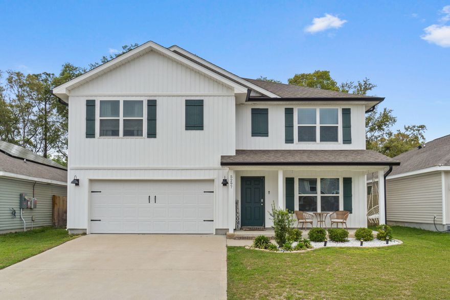 Welcome home to this fantastic 5 bedroom (plus an office AND upstairs loft/living room!), 3 bathroom home located in the popular neighborhood of the Woodlands centrally located in Pace and minutes from I-10, Hwy 90, NAS Whiting Field, UWF, shopping, restaurants, and the Emerald Coast's beautiful beaches. Pull into the community and you're greeted with sidewalks, street lighting, underground utilities, and even a neighborhood park, playground, and splash pad to enjoy those hot summer days! The Hayden floorplan is a beautiful 2 story design with over 2550sqft! As you enter this home, there is a flex space that is perfect for an office, formal dining room, or school room. Through the foyer is the large open living space joined by a gorgeous kitchen and dining area with access to the backyard. The kitchen features all stainless appliances, tasteful tile backsplash, and lots of counter space with a fantastic upgraded wooden framed kitchen island and it's open to the eat in kitchen area. Interior features also include luxury vinyl plank flooring throughout, with plush carpet in the bedrooms, upgraded lighting, and plenty of closet space! There is one bedroom and one full bathroom located on the first floor, and upstairs are the 4 other bedrooms along with a great sized upstairs living room (with a closet!), and the laundry room. The master bedroom is retreat with an oversized room and an en suite featuring two walk in closets, double vanities, a walk in shower with glass door, and private water closet. Upstairs there is also another full bathroom with double vanities. Outside you'll love the updated landscaping and the addition of whole home seamless gutters along with the fully privacy fenced in backyard. Welcome home to 5297 Peach Drive where you'll get all the space you've been looking for within a fantastic neighborhood!