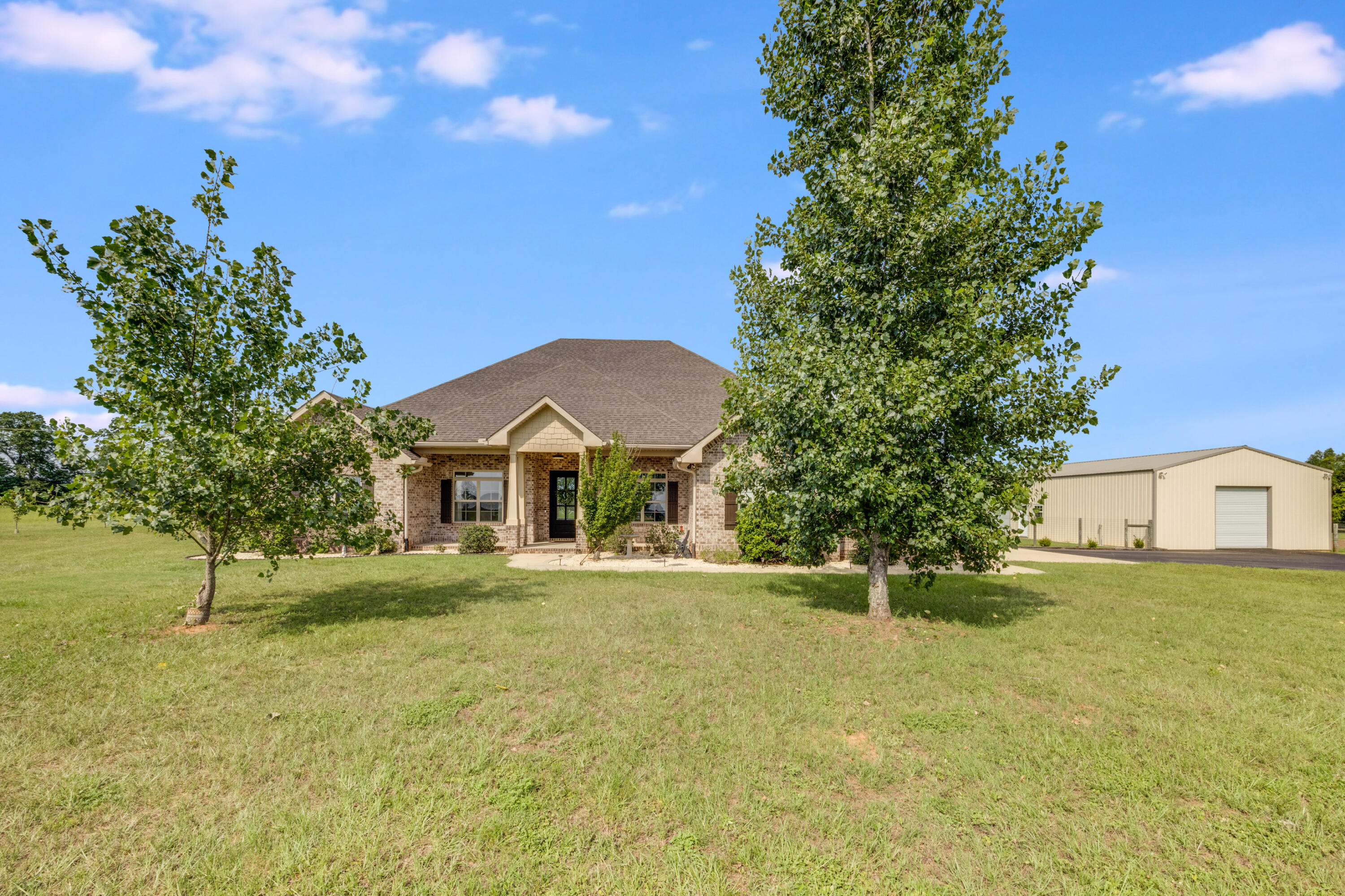 Discover the perfect blend of space, privacy, and modern comfort with this beautifully maintained 4-bedroom, 4-bathroom custom built home set on an expansive 22-acre property! This charming country estate offers serene views, open skies, and endless potential for outdoor living, recreation, or agricultural use.The home features a welcoming front porch, ideal for relaxing evenings or morning coffee while enjoying the peaceful surroundings. Inside, you'll find a spacious layout designed for both comfort and function, with generously sized bedrooms, multiple living areas, and abundant natural light. The kitchen is well-equipped for family meals or entertaining guests, and each bathroom is tastefully appointed for modern living. (Continued) Step outside to enjoy wide-open acreage perfect for horses, farming, or simply soaking in the rural beauty. Whether you're looking to create your dream homestead or enjoy quiet country living with plenty of room to grow, this property offers a rare opportunity.
Additional property features include a 11.5'x10' safe room/ storm bunker complete with concrete walls, steel reinforced rebar and concrete roof as well as a 300mph blast proof door! The 30'x48' workshop has concrete flooring, power, and 2 roll-ups doors - perfect for all of your toys!
Don't miss out on this slice of Florida paradise- schedule your private tour today!