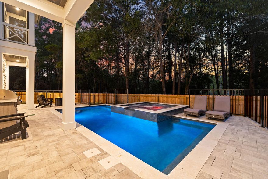 Completed in 2023, this stunning three-story beach house is close to everything on coveted 30A. Occupying a generous 0.4-acre lot, it sits back from the road behind established landscaping. A wide paved driveway and a three-car garage provide ample parking to the front, with an open breezeway giving access to the large private terrace and saltwater pool to the rear. A spillover spa offers a tinkling harmony for the extensive terrace, incorporating a BBQ area and a cozy fire pit for cooler evenings. The entire rear yard is securely fenced and surrounded by established trees, ensuring privacy. The thoughtful architectural design of this brand-new home combines a host of practical features, including EV charging points in the garage, tankless water heaters and two A/C units. Six luxury baths showcase modern fitments and exquisite tiled showers. An open front porch on the first floor features a screened balcony above. To the rear, screened porches on the second and third floors overlook views of a tree-lined nature pond. They provide the perfect place to toast sunset skies or listen to the serene quietness of the woods before dinner. The first floor houses a bonus room with a pool table and a lounge/TV area. There's a handy wet bar with an ice maker for serving drinks. Fill up the refrigerator, and you're all set. The open family room on the second floor has dual-height windows with transoms, delivering abundant natural light to each carefully curated space. The generous sitting area is perfect for gathering together at the end of the day to chat over cocktails and pre-dinner snacks. A contemporary dining table seats eight for dinner, with further seating for six on tall stools at the polished black quartz waterfall island with a bar. Designed for functionality and social interaction, the chef-inspired kitchen is perfect for indulging your culinary creativity. Top-of-the-line Viking appliances include a 36-in. gas range and stove. Calacatta Bella countertops rub shoulders with tall Alder Husk cabinets, while satin bronze drawer pulls and matching plumbing fixtures add an additional wow factor. One of the guest suites is also located on this level. Retreat to the third floor, where two magnificent master suites with fantastic custom closets are perfect for savoring moments of quiet serenity. Check out the breathtaking master bathroom with its marble-clad walls surrounding an oval garden tub. Windows frame relaxing views of the treetops. Behind a sliding barn door, a bunk room has built-in bunks for four. Across the hall is another bedroom with a full bathroom. This home is within easy reach of beautiful white sandy beaches, high-end dining and an abundance of shops and entertainment. Brand new, fully furnished, and turnkey, this luxury beach house is a fantastic buy for investors or for those looking for the perfect second home.